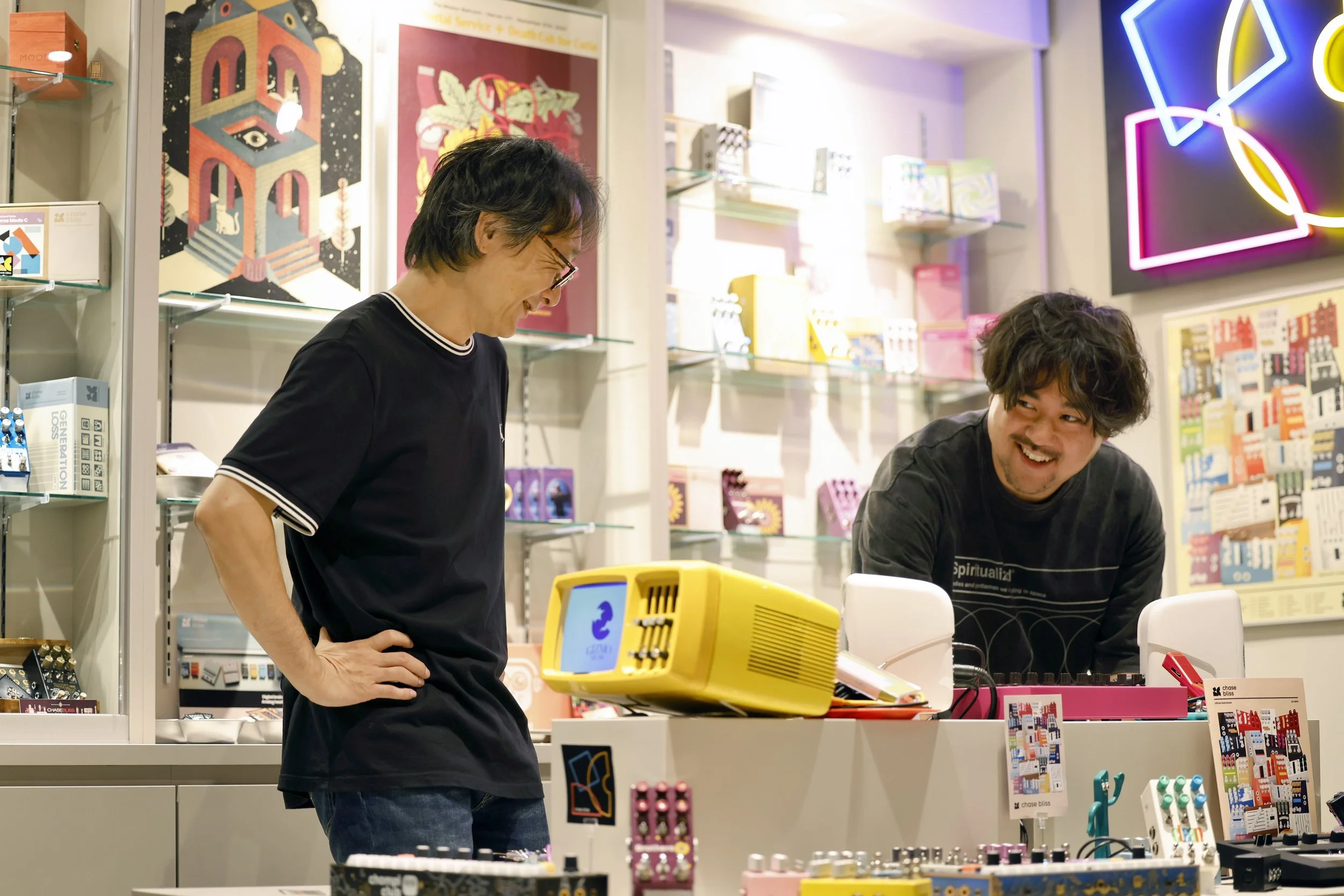Takeo and Rio from Umbrella smiling and laughing.