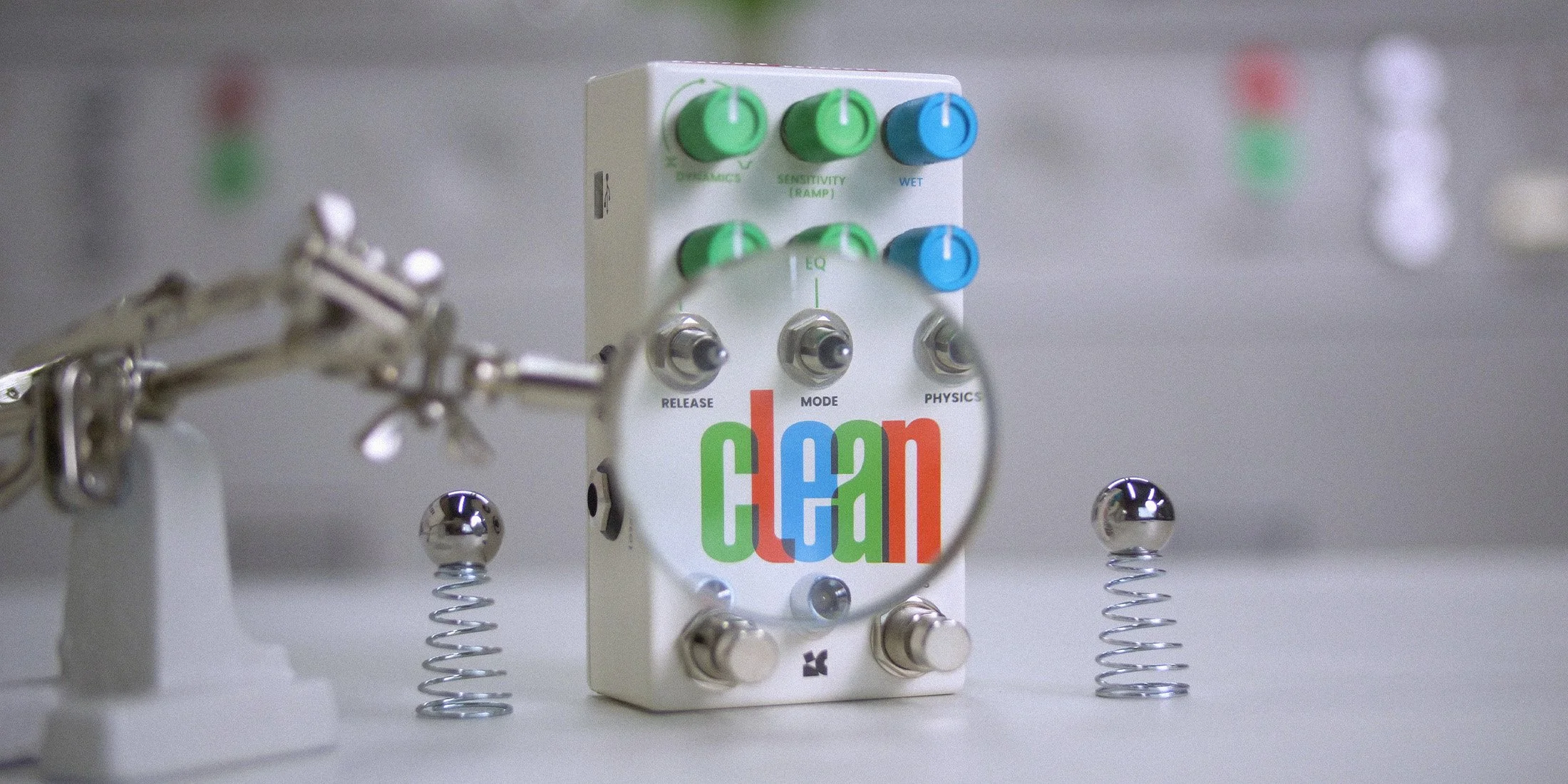 Clean effects pedal placed on retro sci-fi equipment.