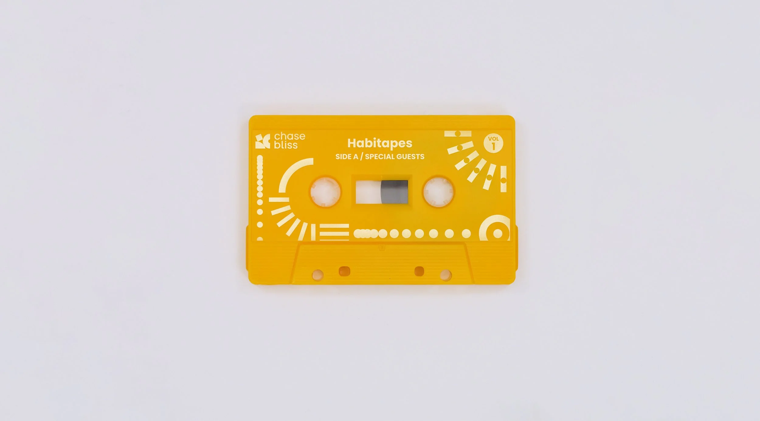 Yellow cassette tape that says Habitapes.