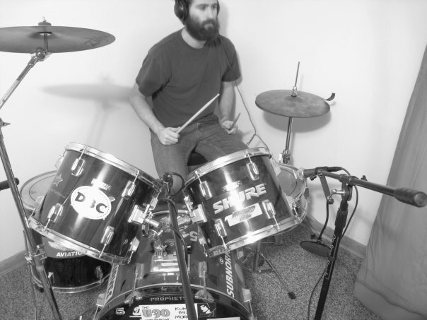 Person (Joel Korte) drumming.