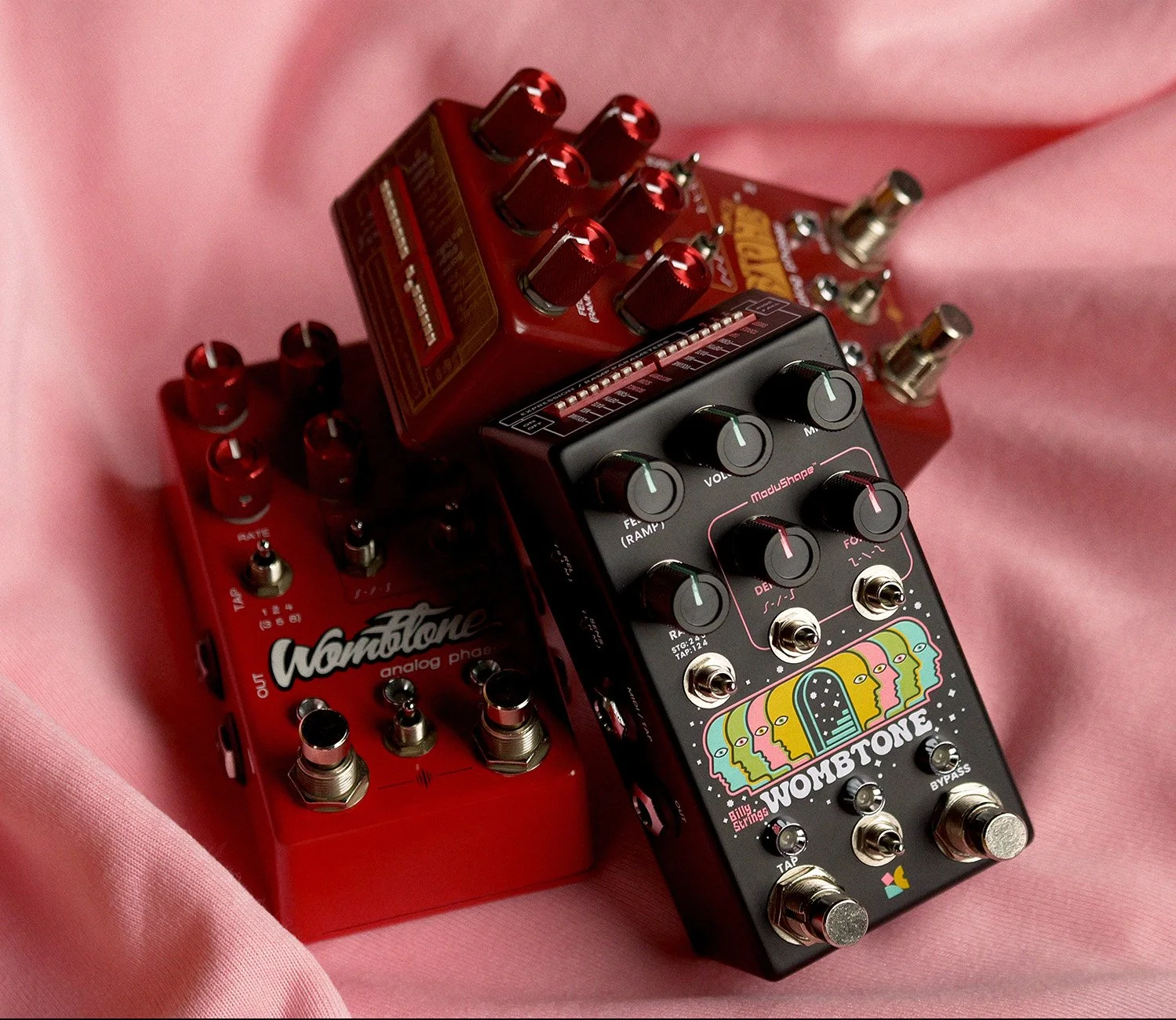 A pile of guitar pedals; all being different version of the Wombtone by Chase Bliss.