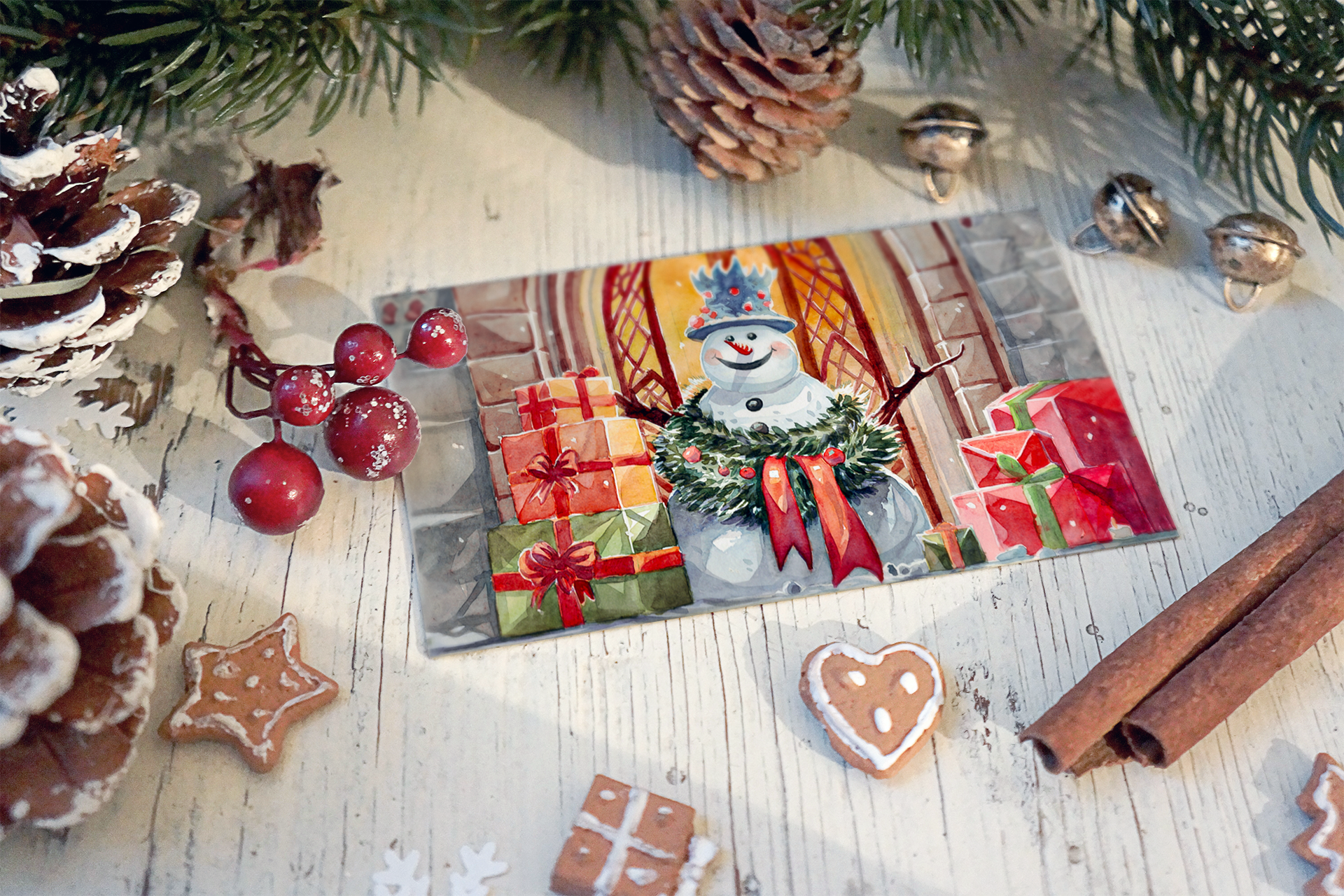 Christmas scene with pinecones, holly berries, cinnamon sticks, gingerbread cookies, festive illustration of a snowman with presents, surrounded by pine branches and bells.