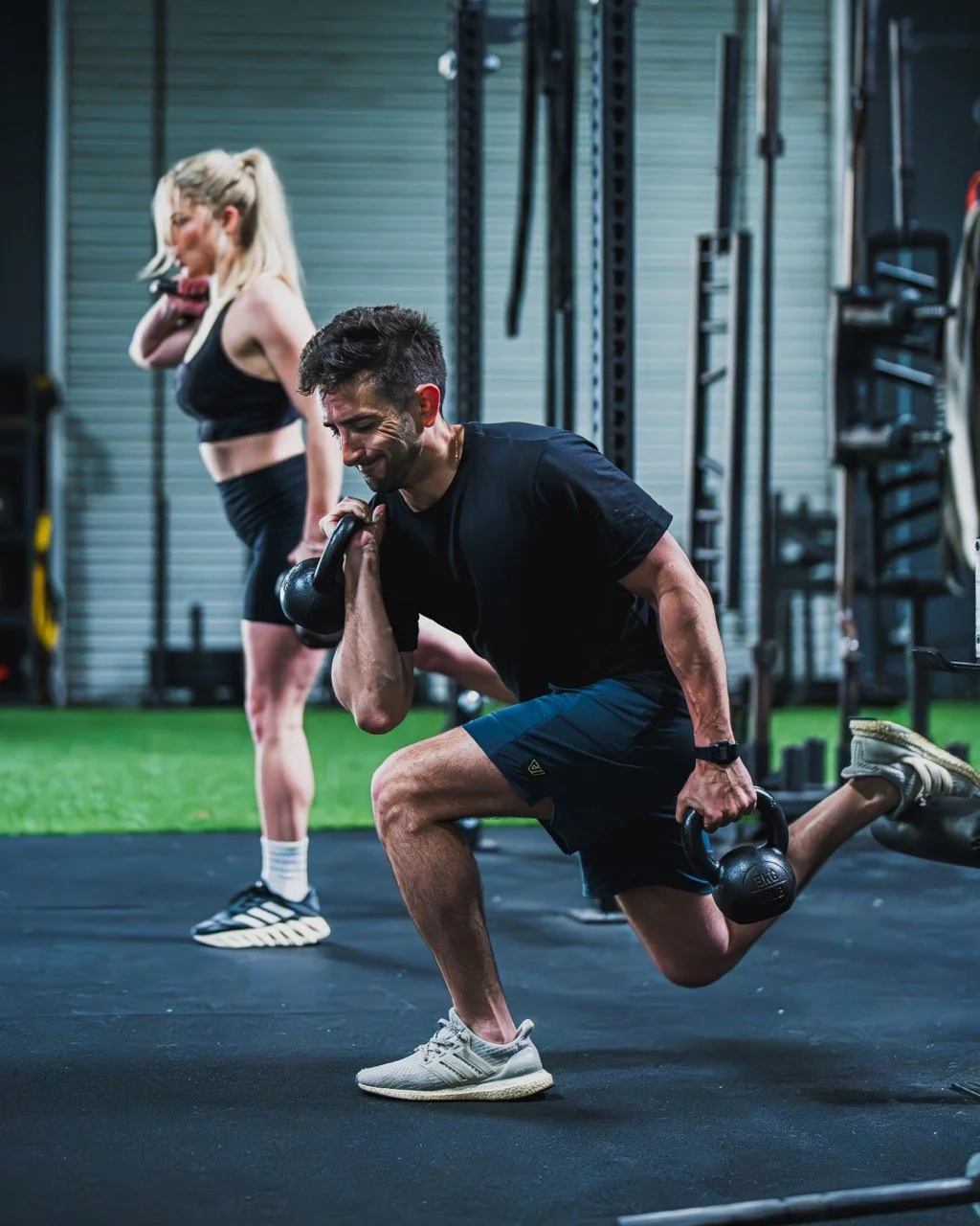 Adult client performing functional strength exercise with coach guidance