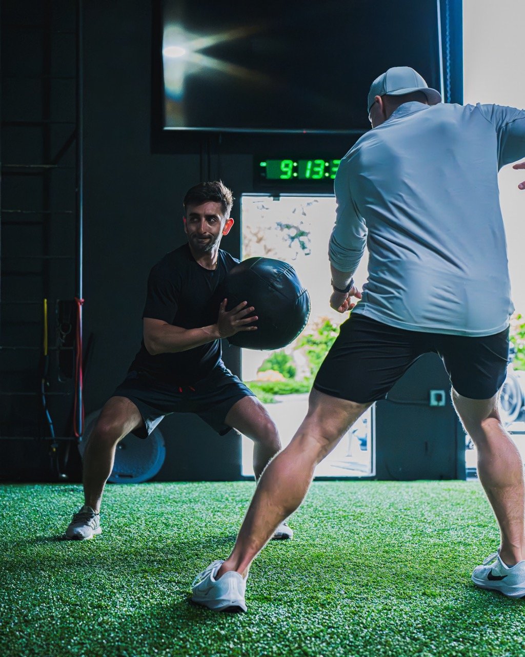 Joe Dell working with individual student athlete for performance training