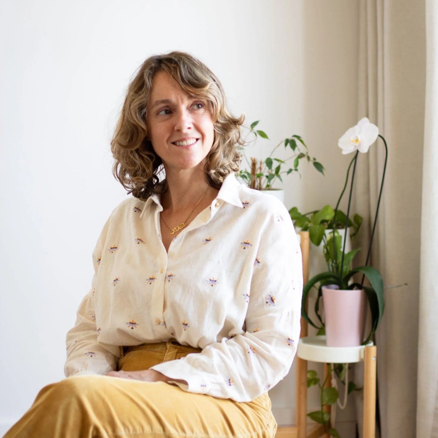 Clare Jones Paris based illustrator sitting in her studio