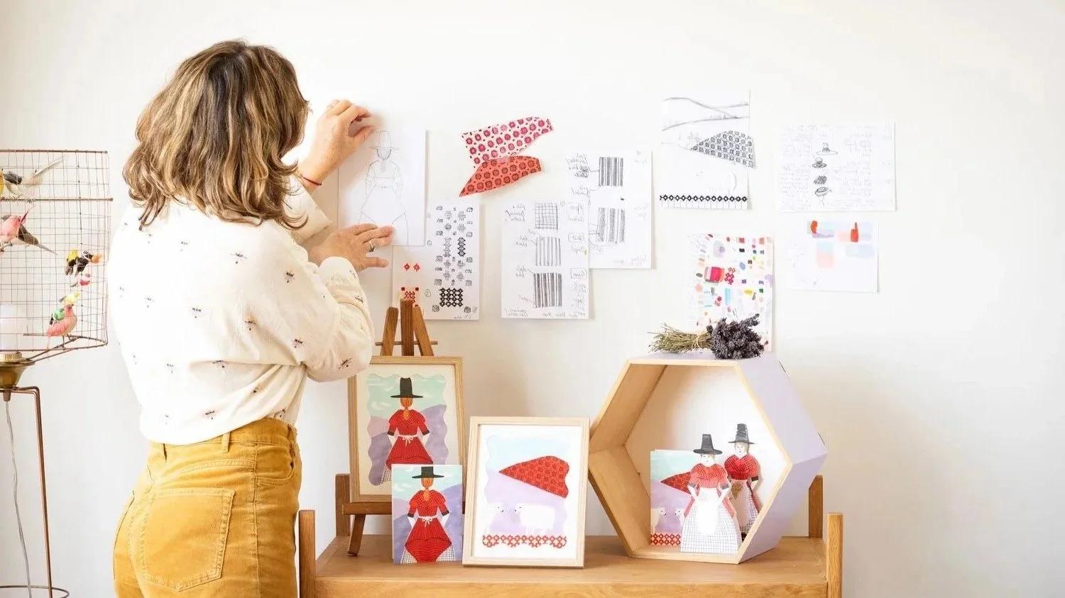 Clare Jones freelance illustrator and graphic designer based in Paris. Photo taken of Clare working in her studio