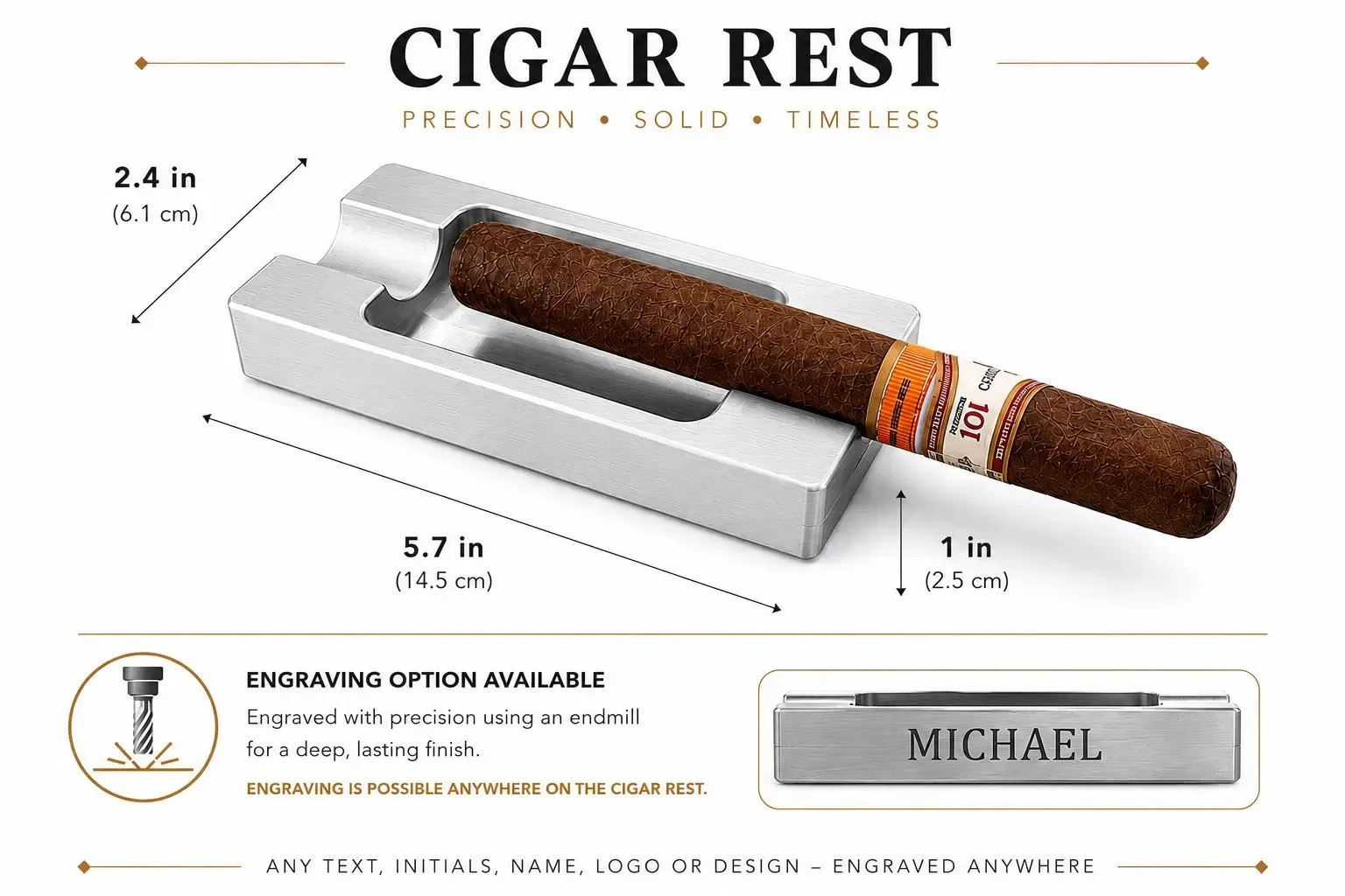 A cigar rest holder with a cigar resting on it, with measurements noted as 2.4 inches high, 5.7 inches long, and 1 inch wide; the cigar has a label with the brand name 'Montecristo'; an engraving option is available for customization.
