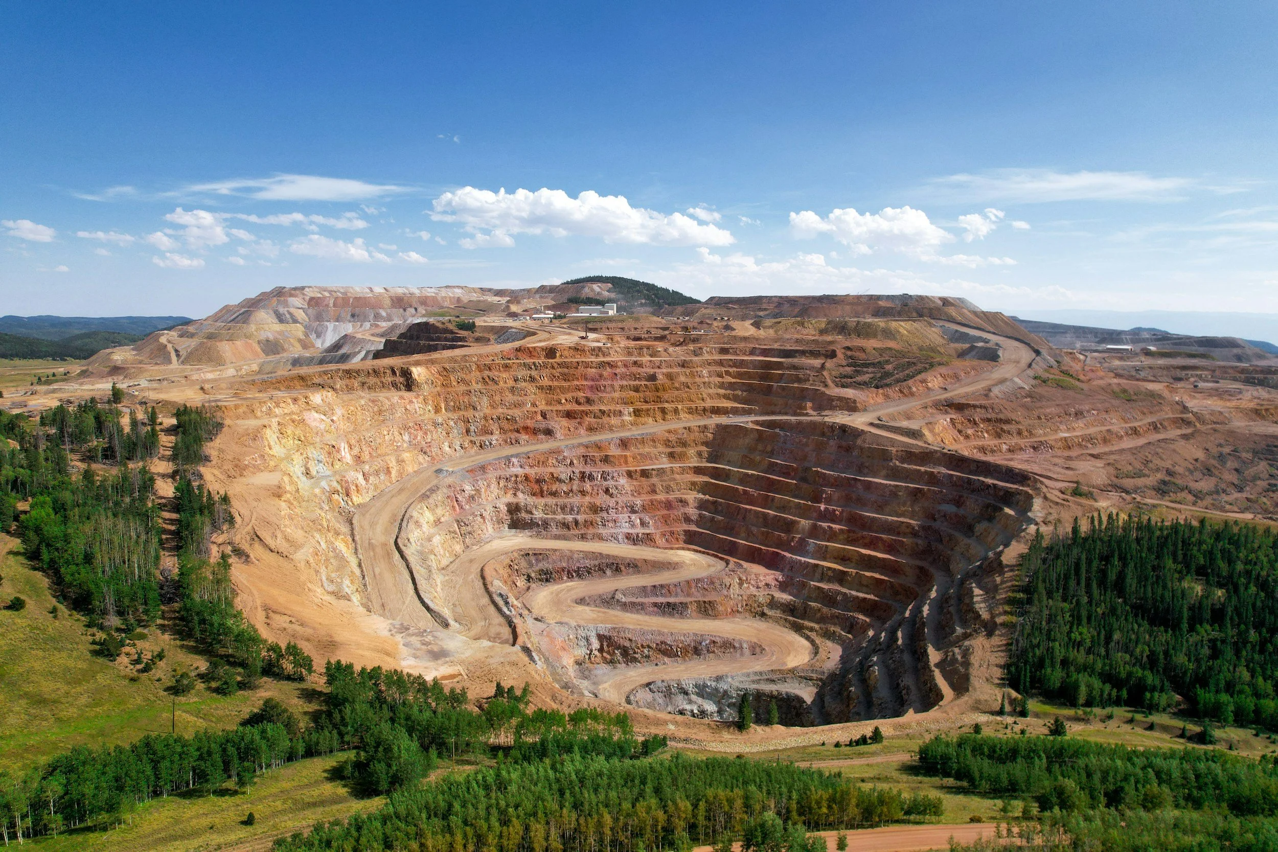 Aerial view of a large open-pit mine, reflecting Gray Oak’s work in responsible mining and natural resources.