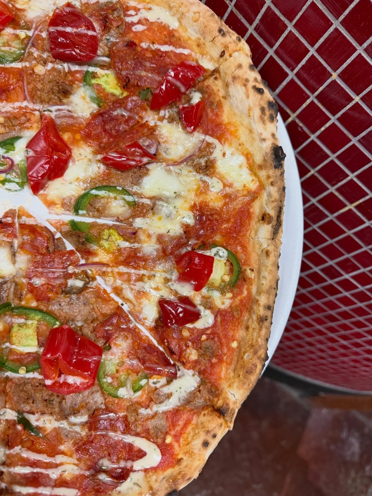 This pizza is SO GOOD! Sausage, Soppressata, Jalape&ntilde;os, and our new (but old to Kelly because she&rsquo;s from Seattle) favorite, @mamalilspeppers Finished with house made Hot Honey Ranch. Get in here, try it out.