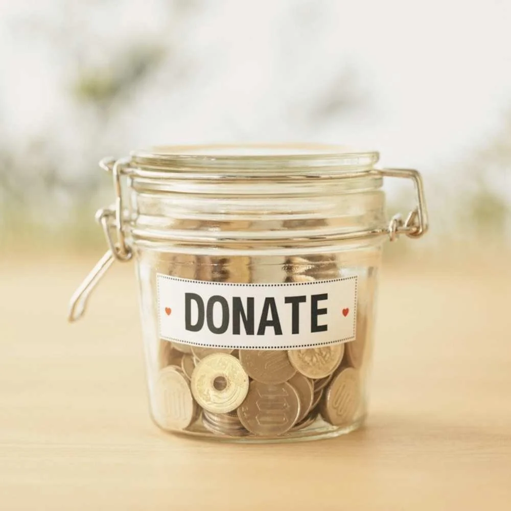 jar full of coins labeled donate