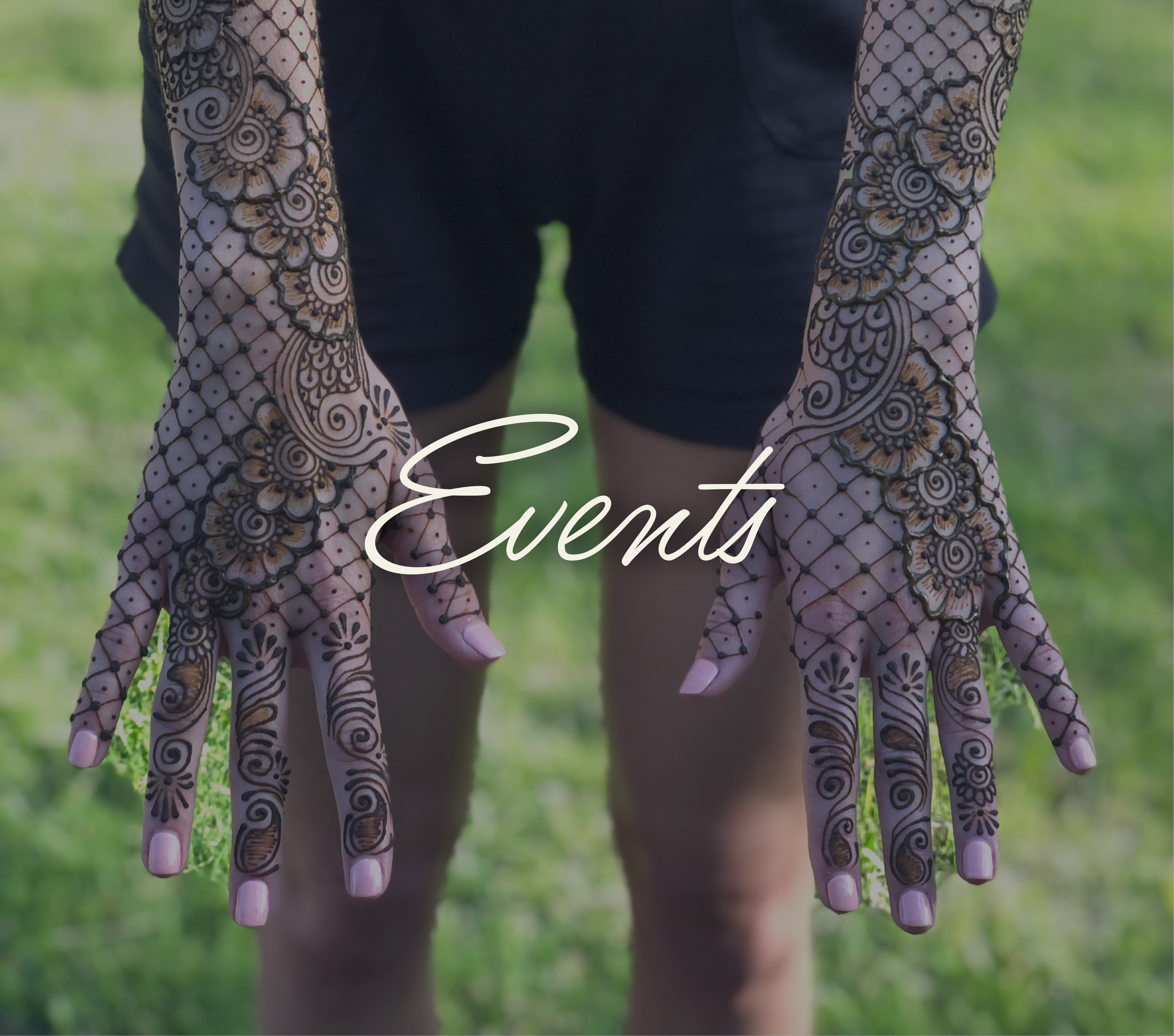 Person with intricate henna tattoos on their hands and forearms, outdoors on grass with the word "Events" overlayed in script text