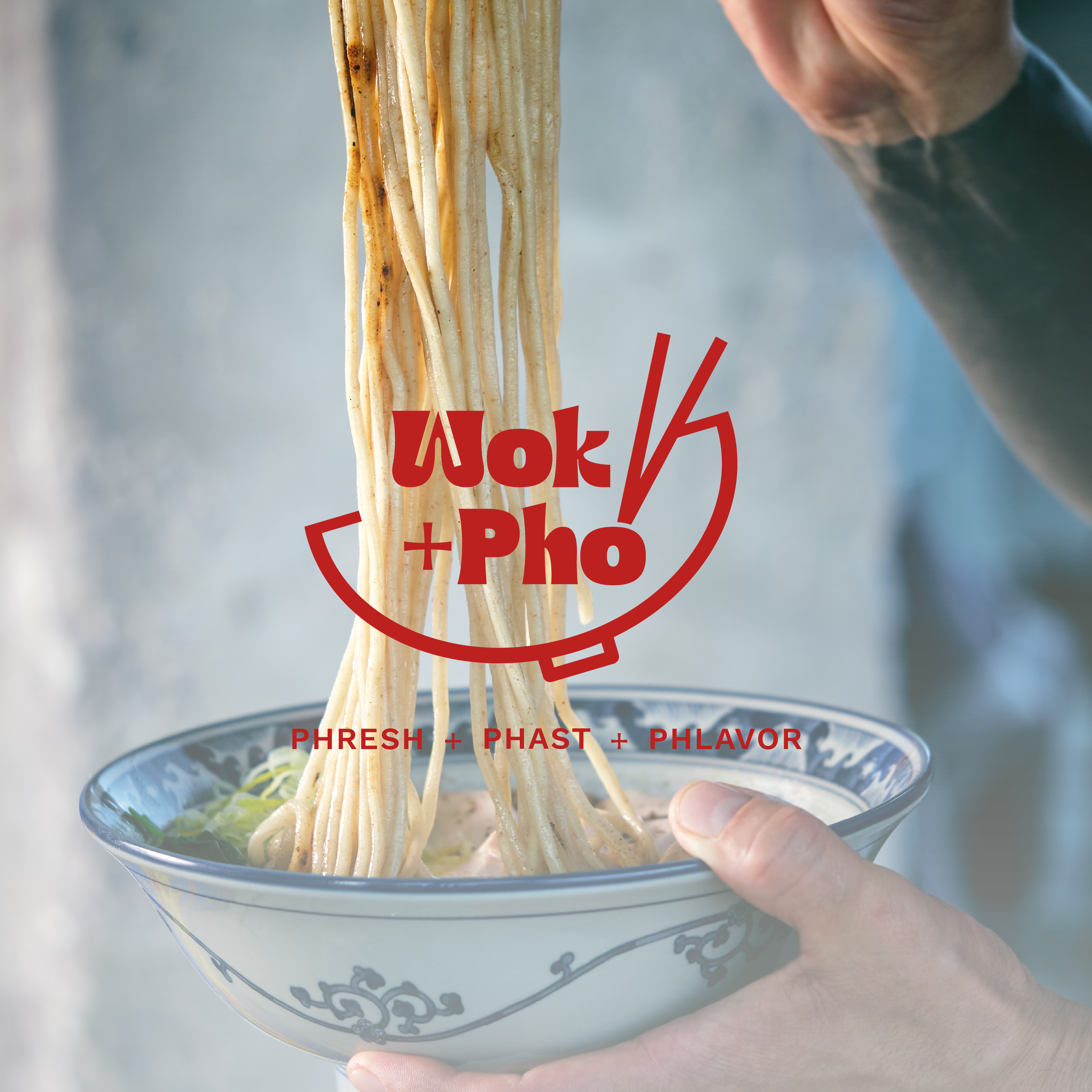 Wok + Pho logo over pho photo