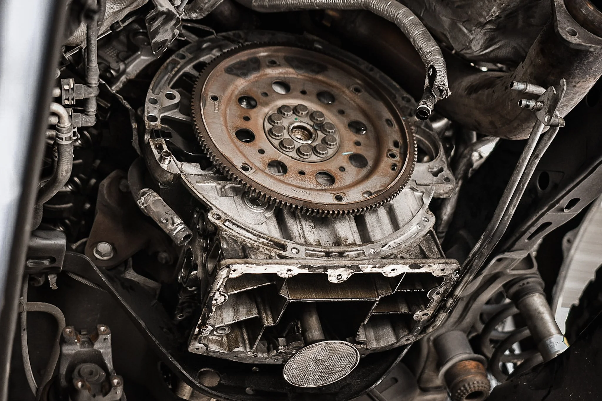 Close-up of a Powerstroke engine showing a flywheel and engine block components.