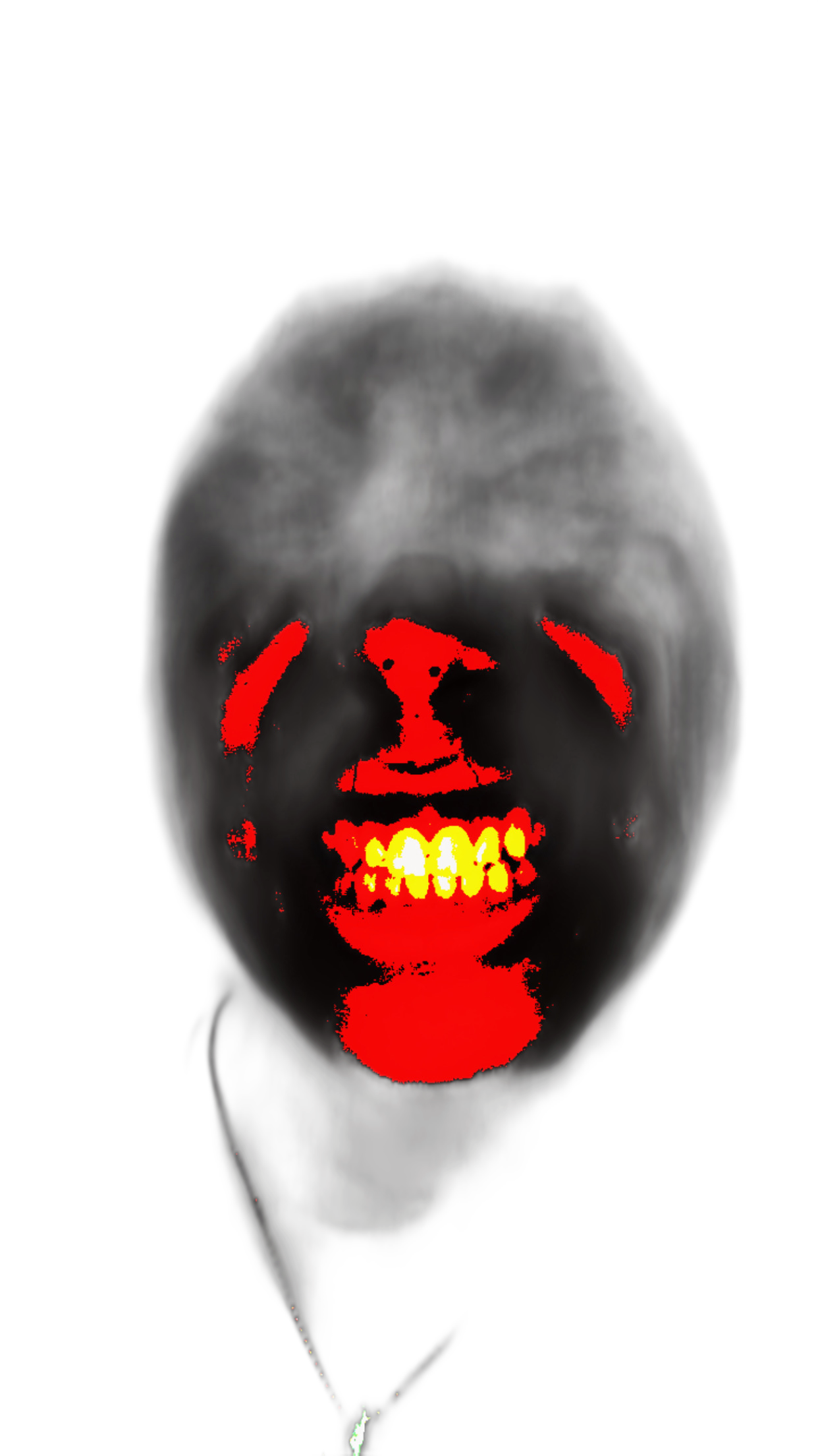 A person with face painted to resemble a scary clown, with a red and yellow mouth, dark eyes, and a black background.