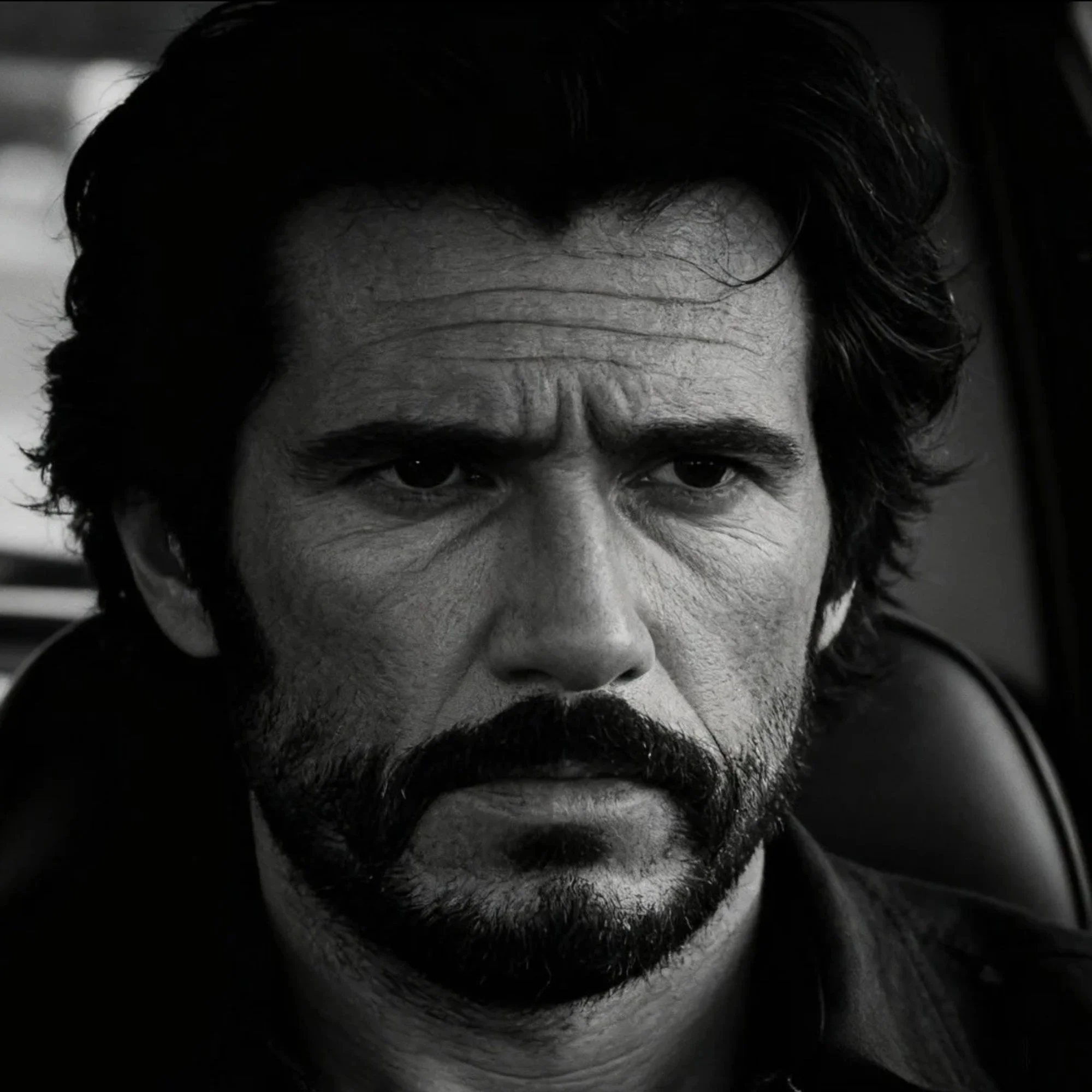 Black-and-white portrait of Hancock Pike wearing a dark shirt and looking directly at the camera.