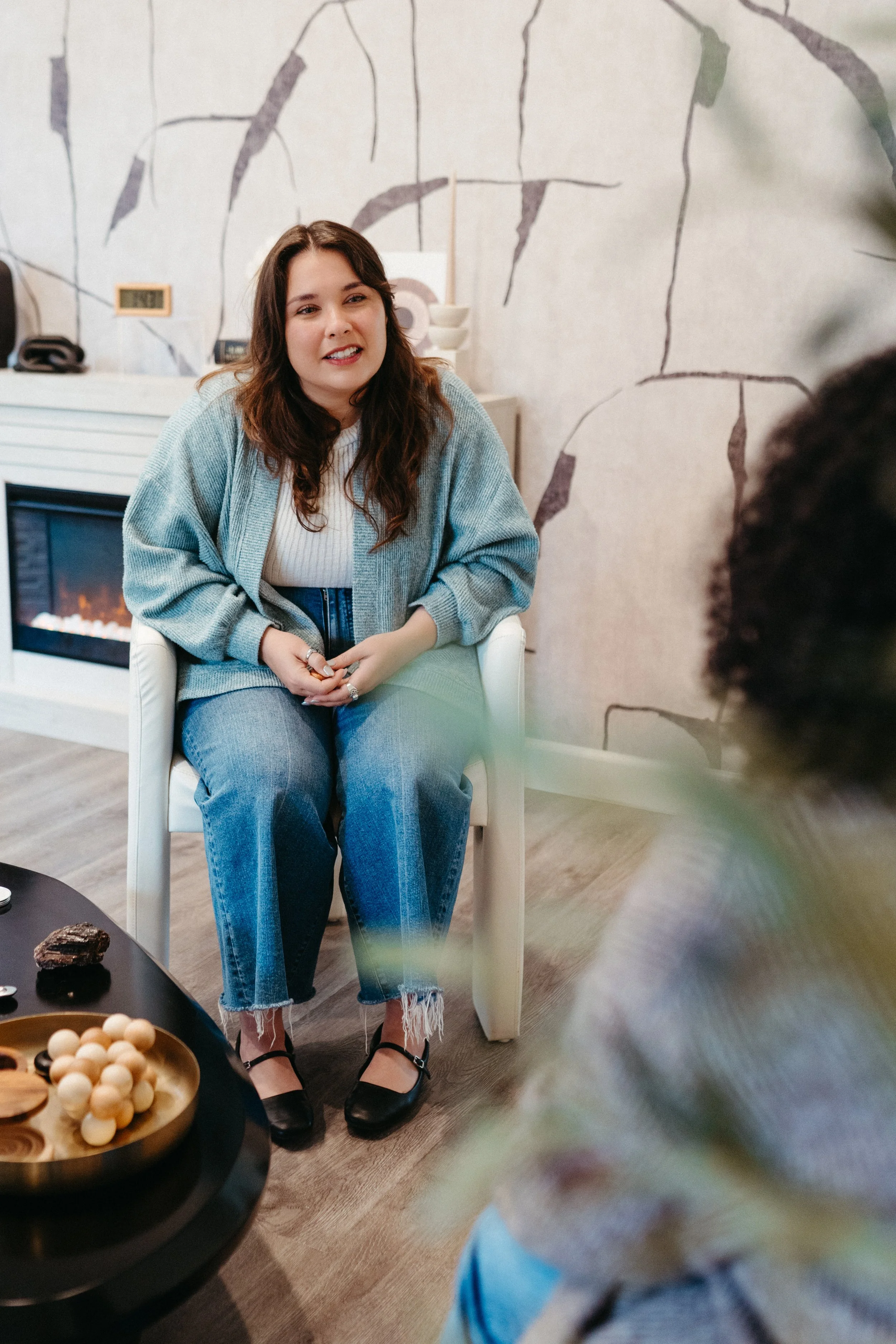 Photo of a Nido IFT therapist listening while a client shares