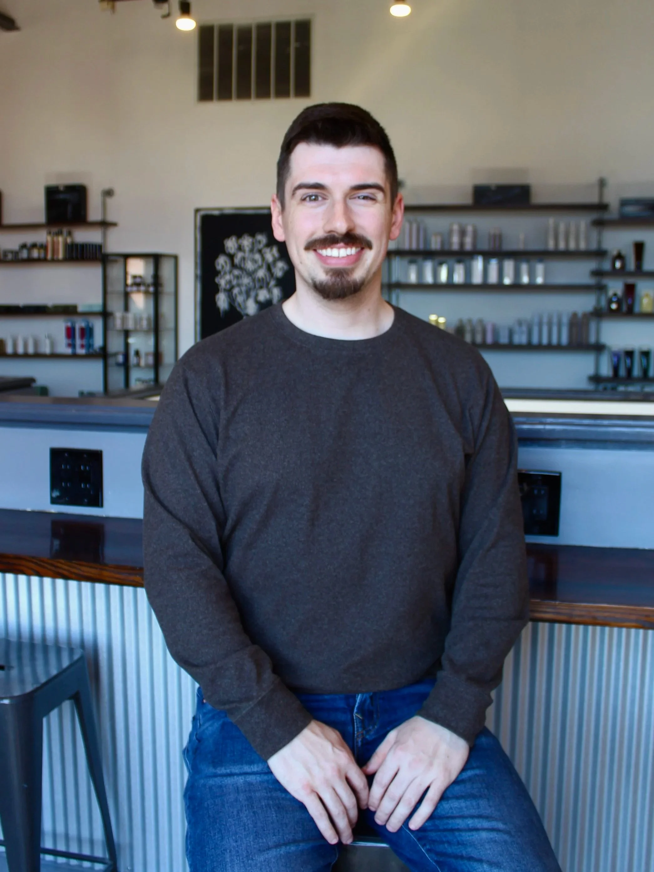 Cameron Johnson is a front desk manager for Salon 387