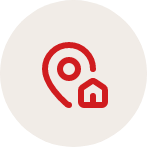Red and white icon of an ear with a small house inside it on a light gray background.