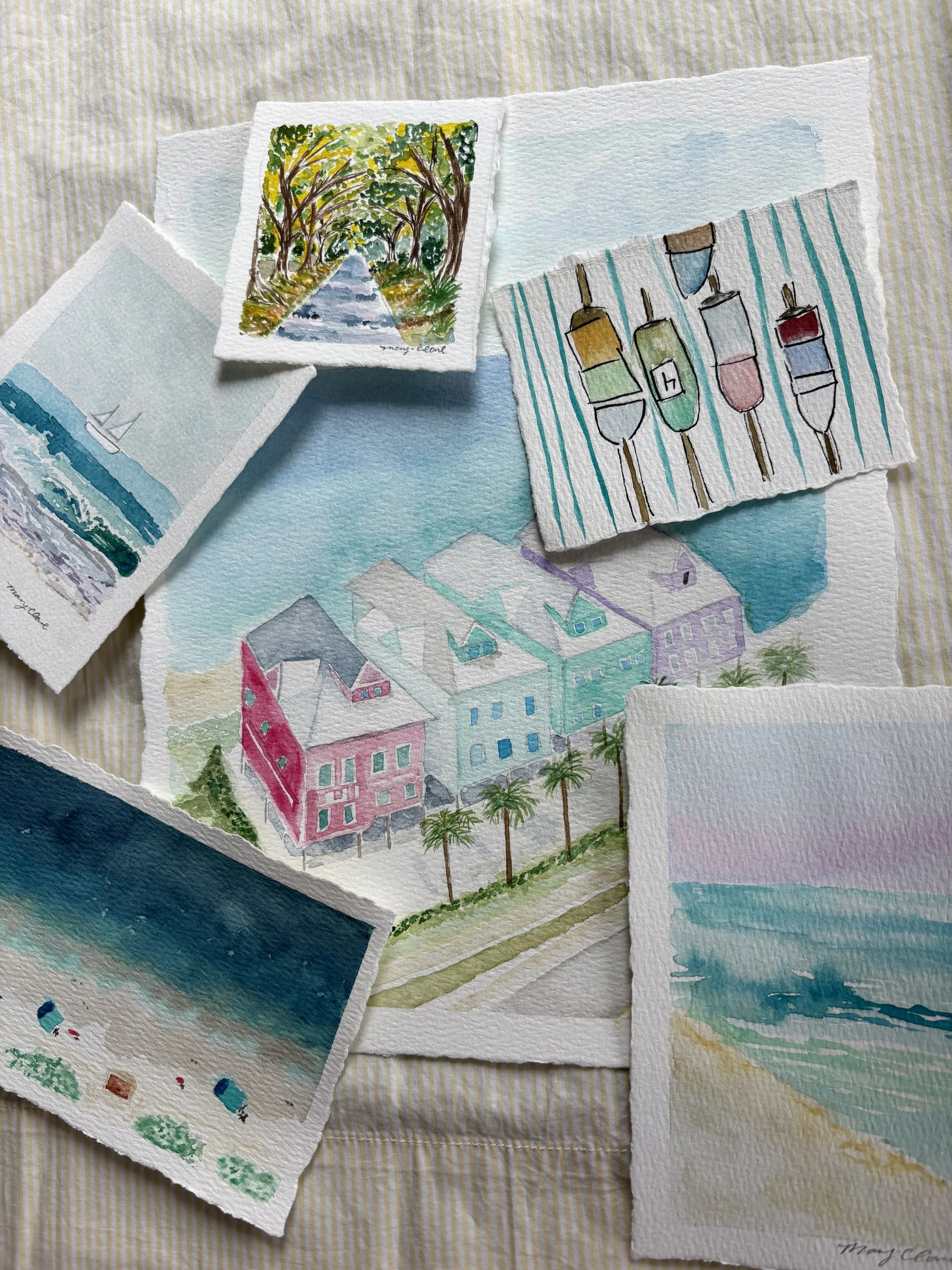 Collection of watercolor paintings including a beach scene, a pathway through trees, a row of colorful houses with palm trees, and abstract images of bottles, a sailboat, and a seascape.