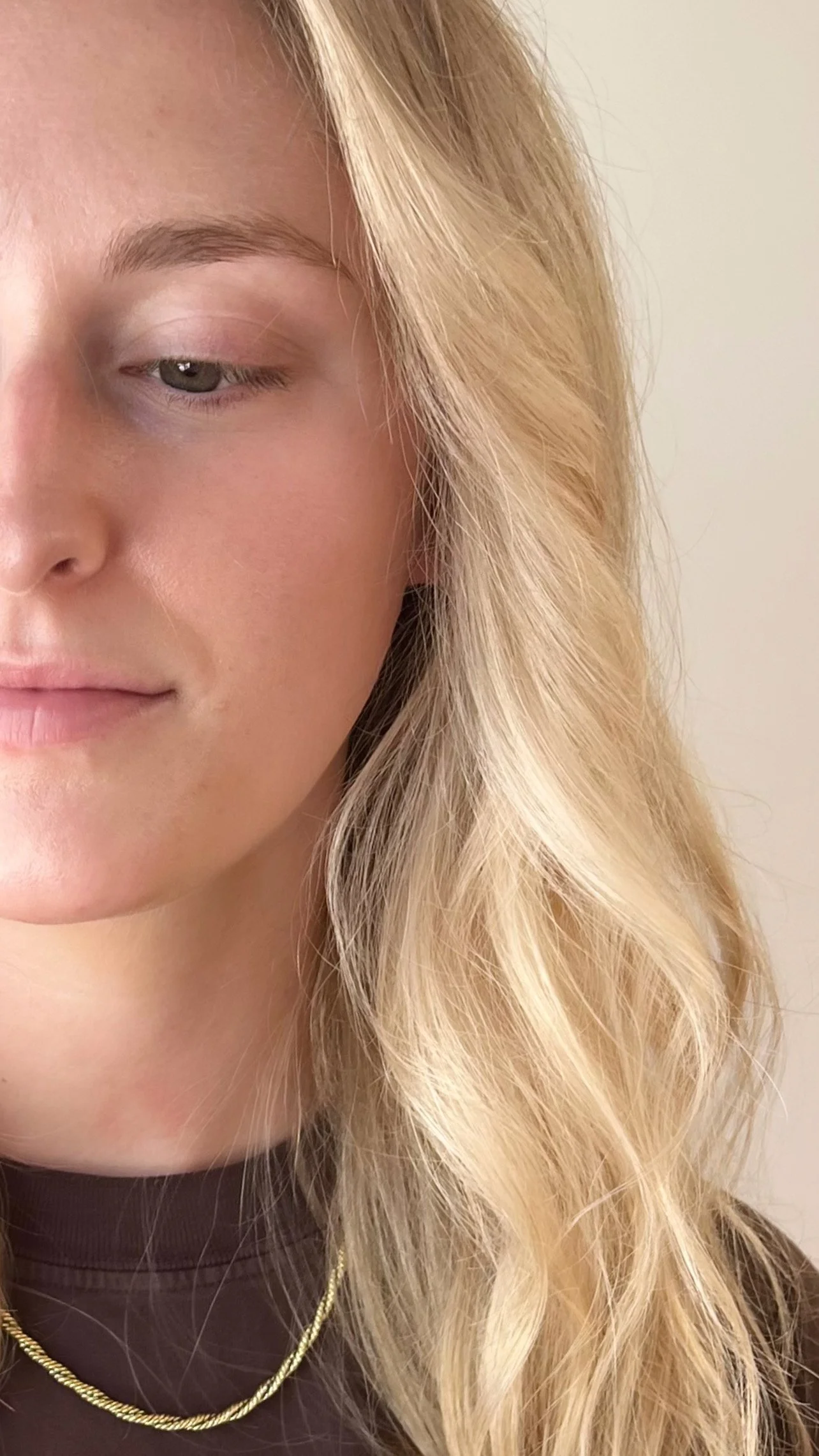 Close-up of soft, dimensional blonde hair after customized blonding session in North Park San Diego.