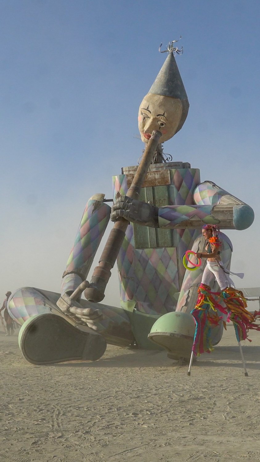 stilt walker mezzanine burning man.jpg