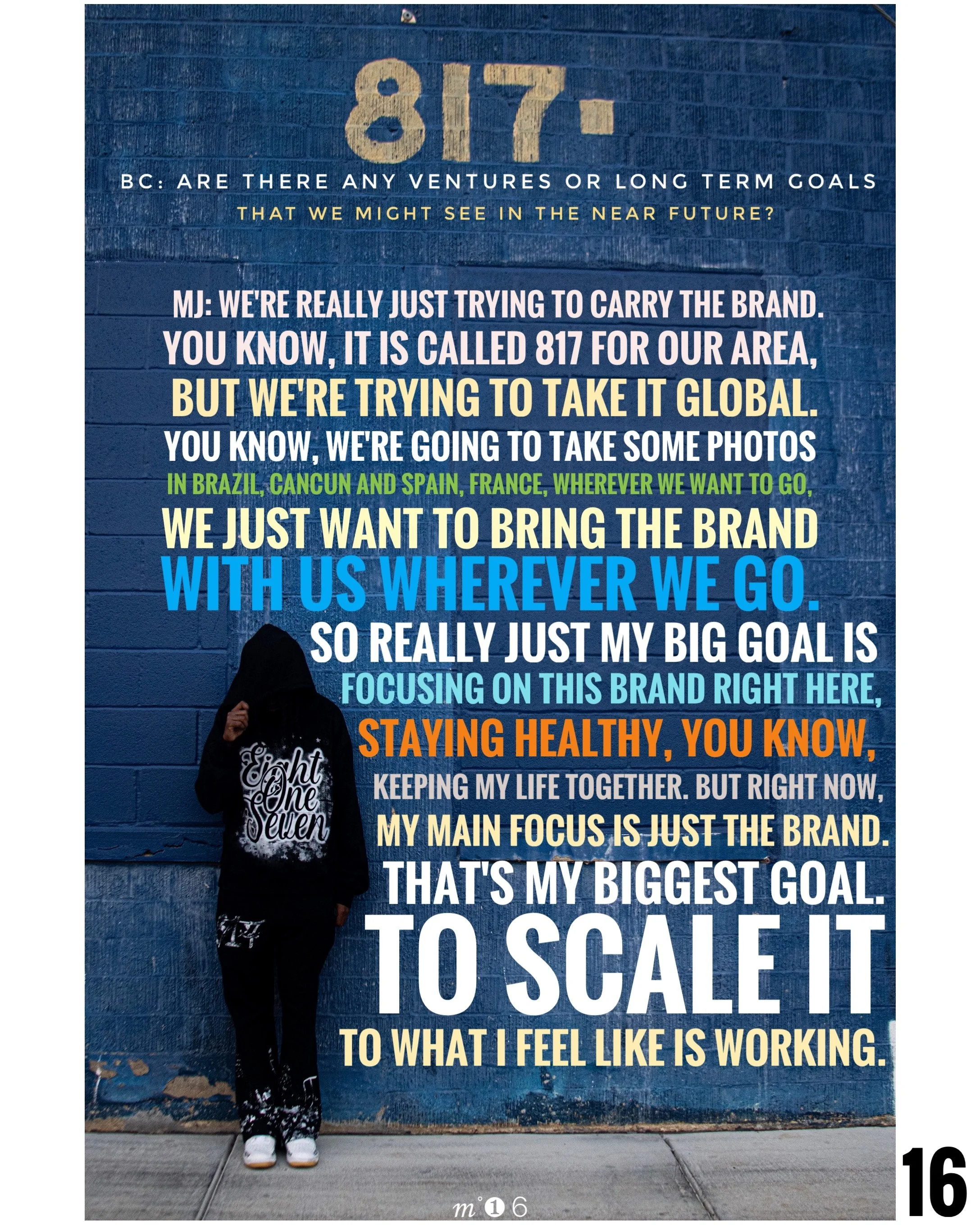 A mural on a blue brick wall with text about branding and goals, featuring a person in a black hoodie and pants with white lettering, standing against the wall.