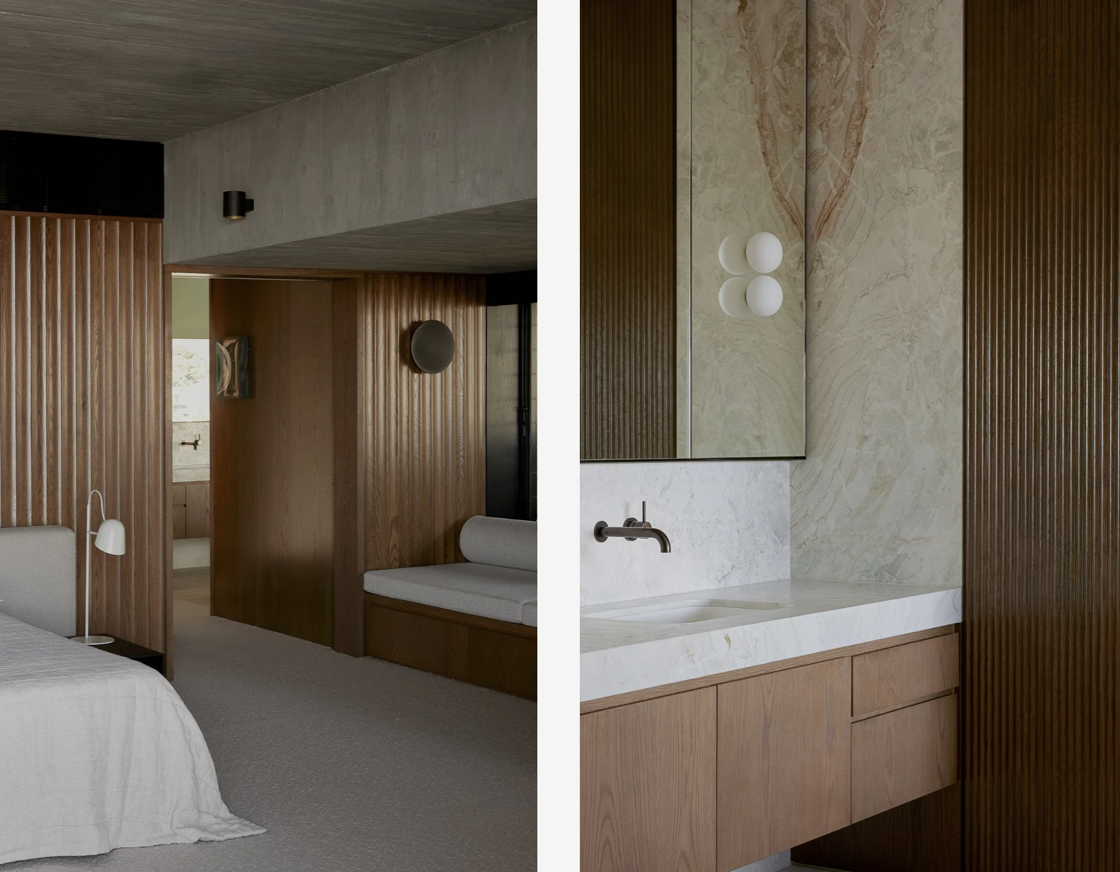 Interior of a modern bedroom with wooden paneling, a built-in bench with light upholstery, a white bed with a bedside lamp, and a bathroom vanity with a marble countertop and a mirror.