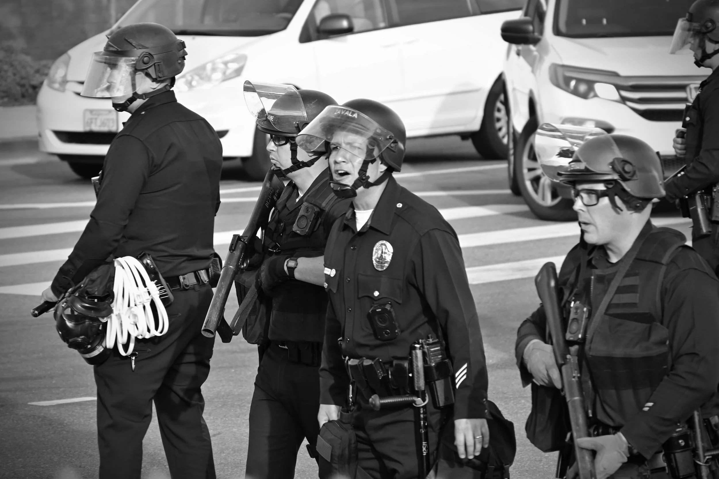 LAPD officer yelling back at protesters after one threw a rock. (Los Angeles, 2026)
