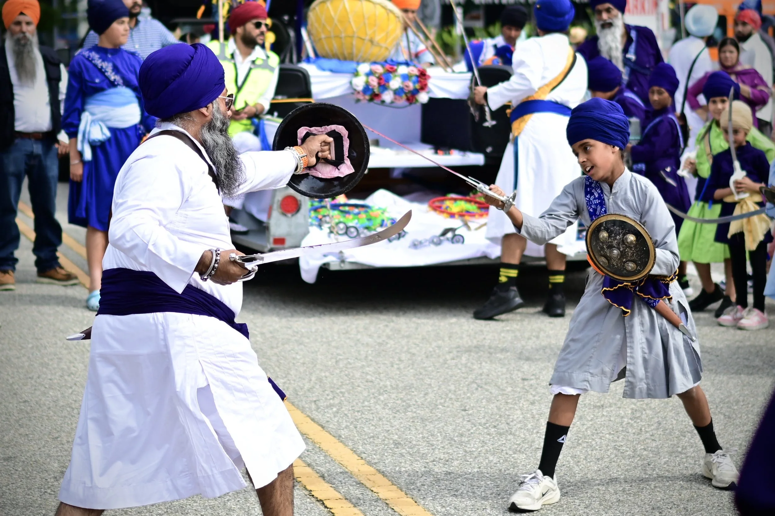 Sikh man and child participating in a round of Gatka. (Los Angeles, 2026)