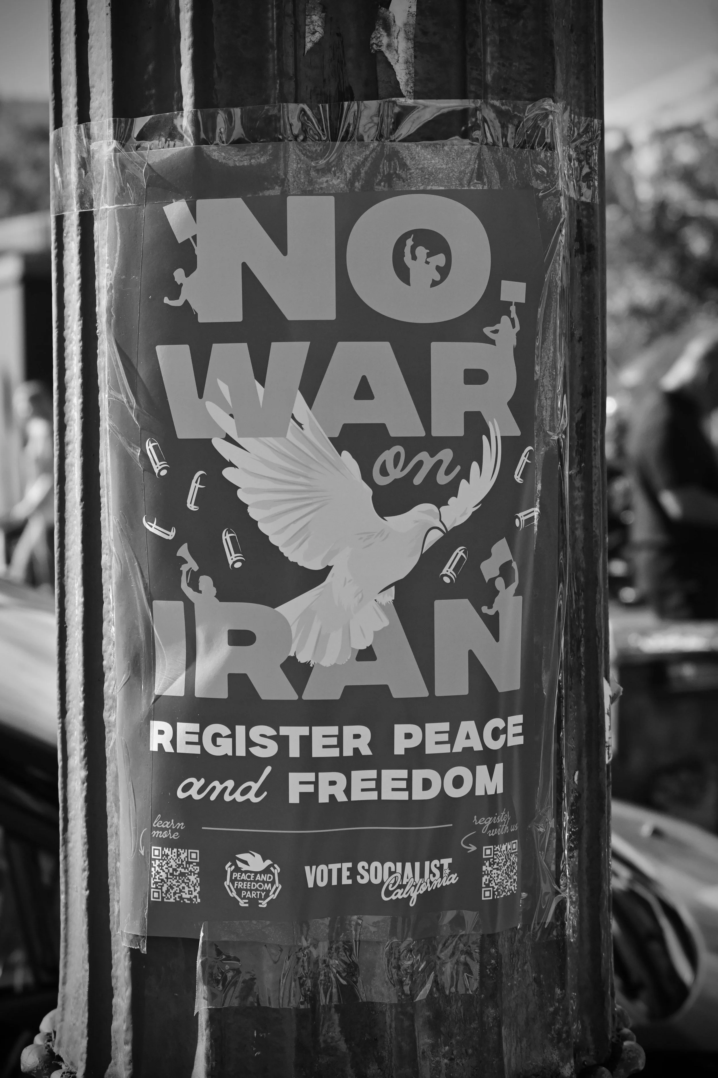 No war on Iran flyer on lamp post. (Los Angeles, 2026)