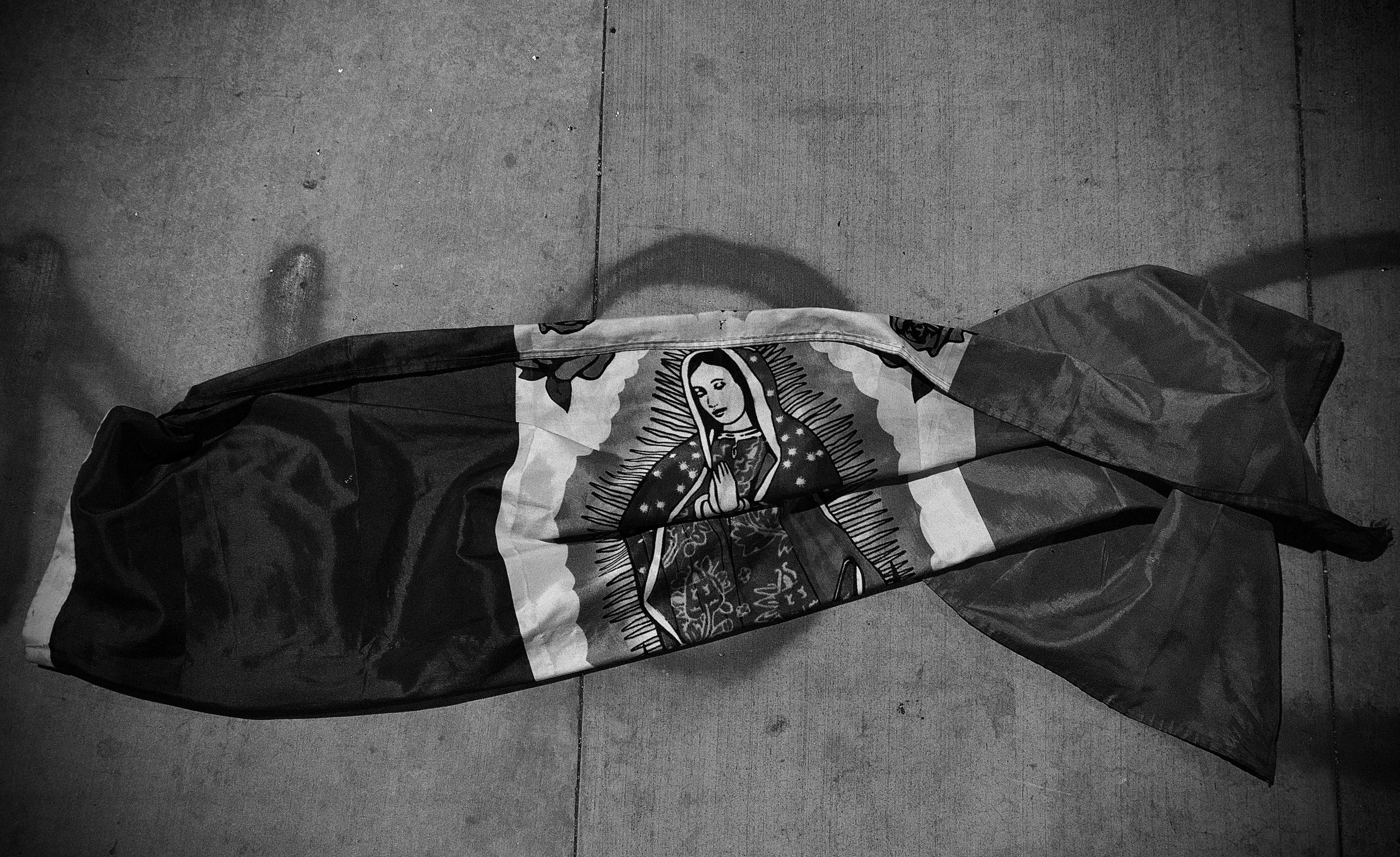 Mexico's flag lies on the street in front of the Los Angeles Detention Center. (Los Angeles, 2025)