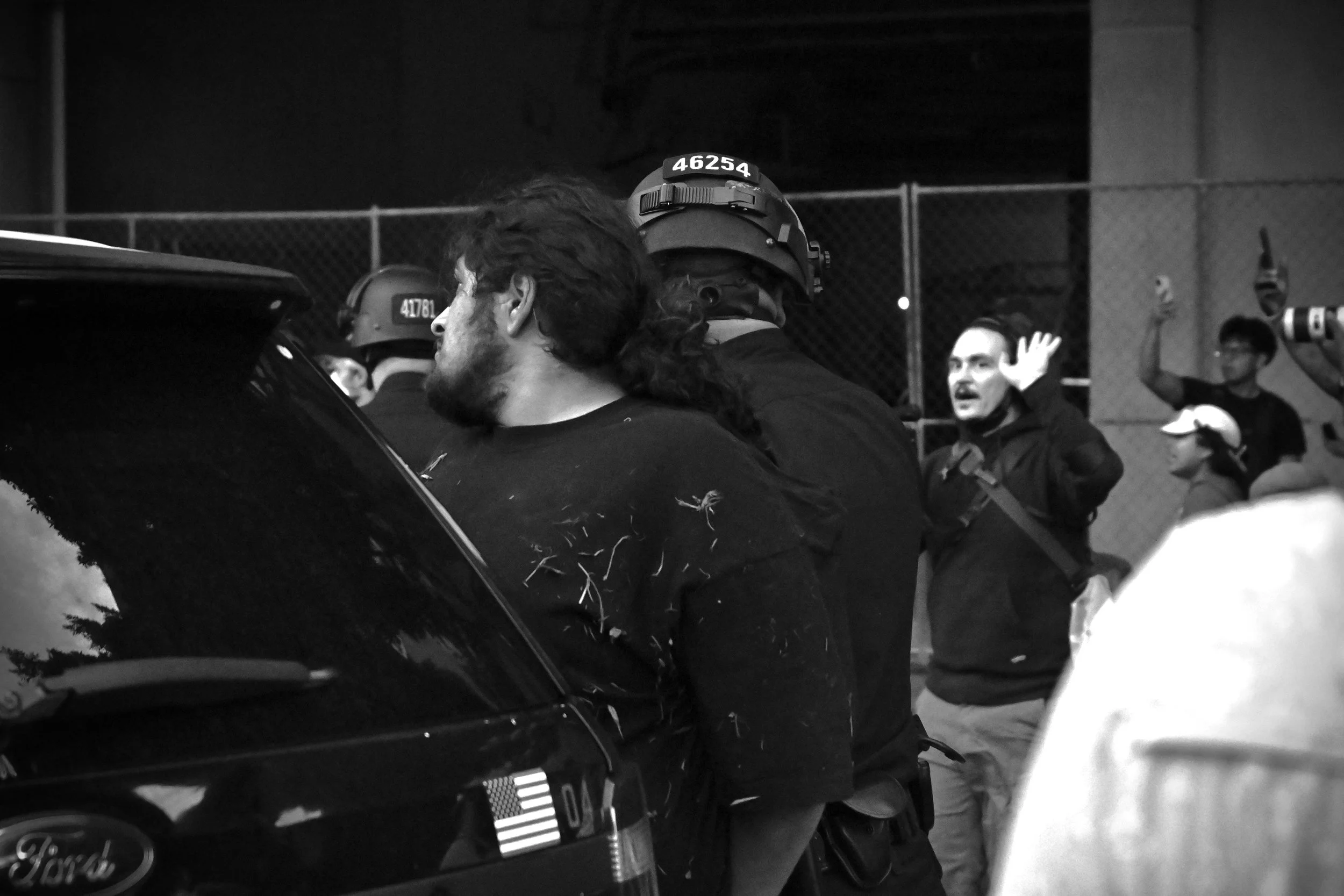 Scenes from an arrest during the protest as it continued into the evening. (Los Angeles, 2026)