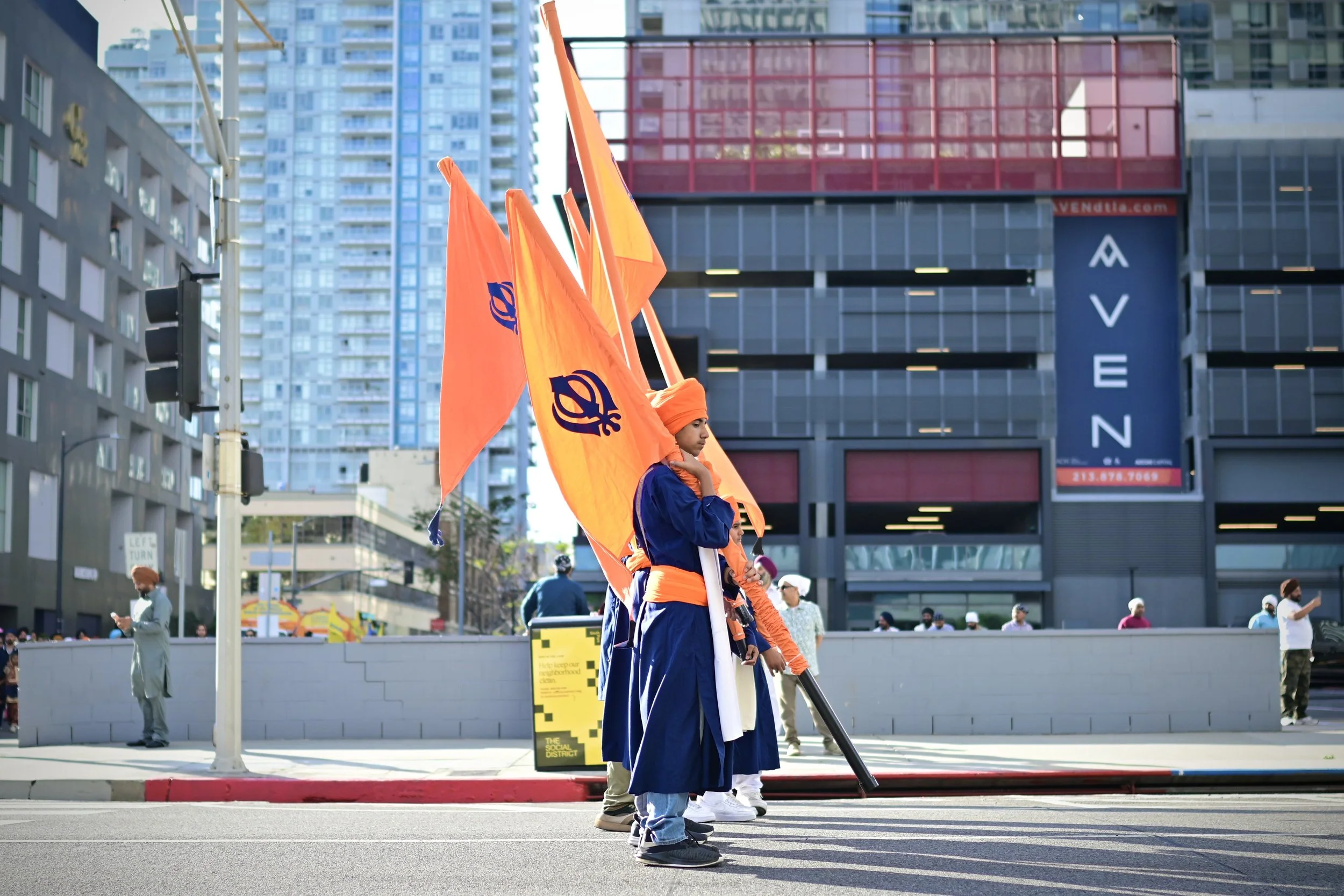 The Nishan Sahib Sevadars and the five flags of Nishan Sahib. (Los Angeles, 2026)