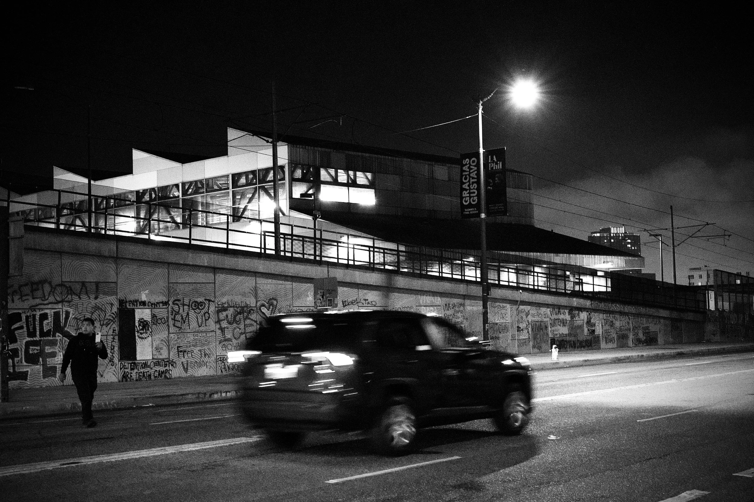 A wall of graffiti stretches along the street opposite the Detention Center. (Los Angeles, 2025)