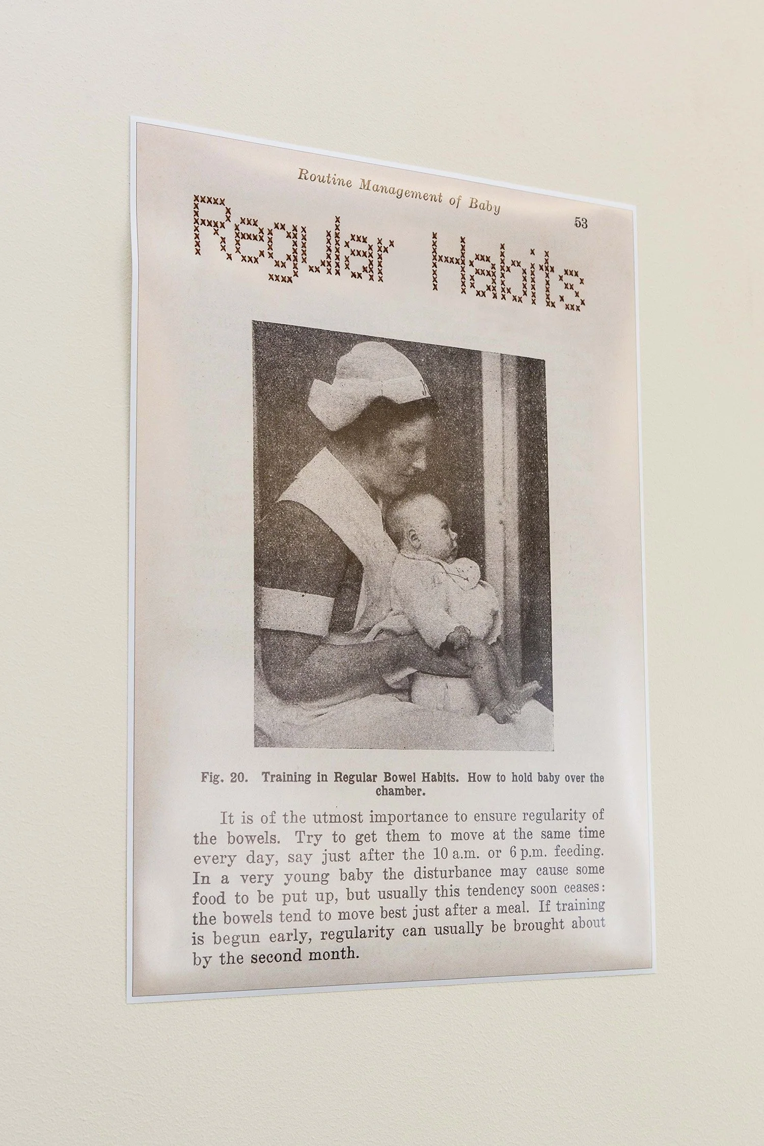 A scan from Sir Frederic Truby King's 1913 book 'Feeding & Care of Baby', with 'Regular Habits' title added in cross-stitch to play on his controversial ideologies. Image in 1942 revised edition.