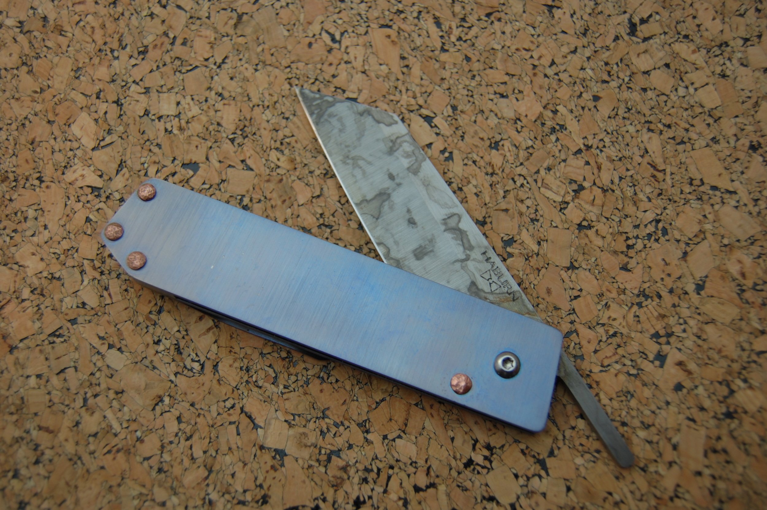 Lightweight titanium friction folder