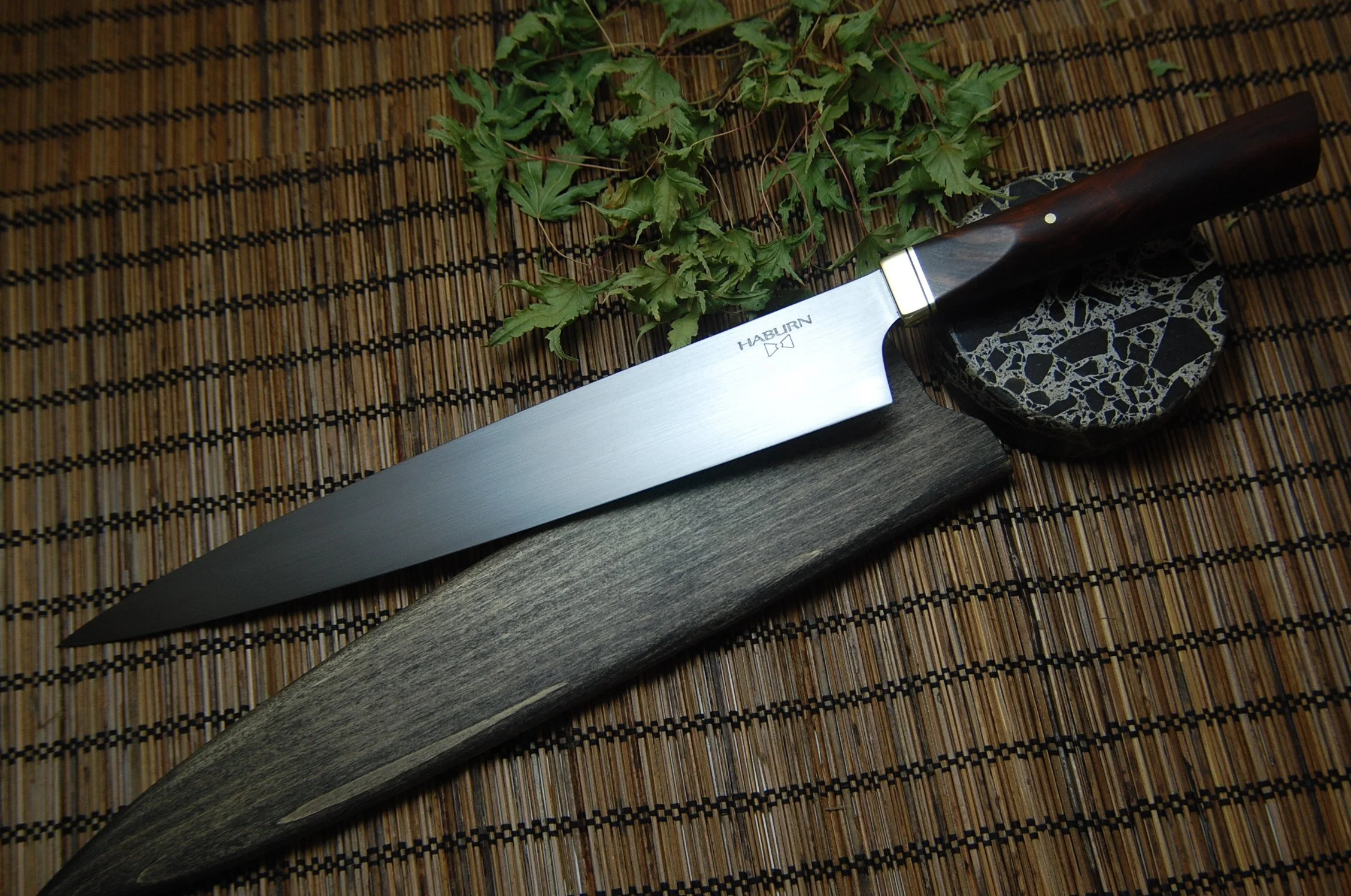 Custom Sujihiki in 52100 high carbon steel with a brass and ironwood handle.