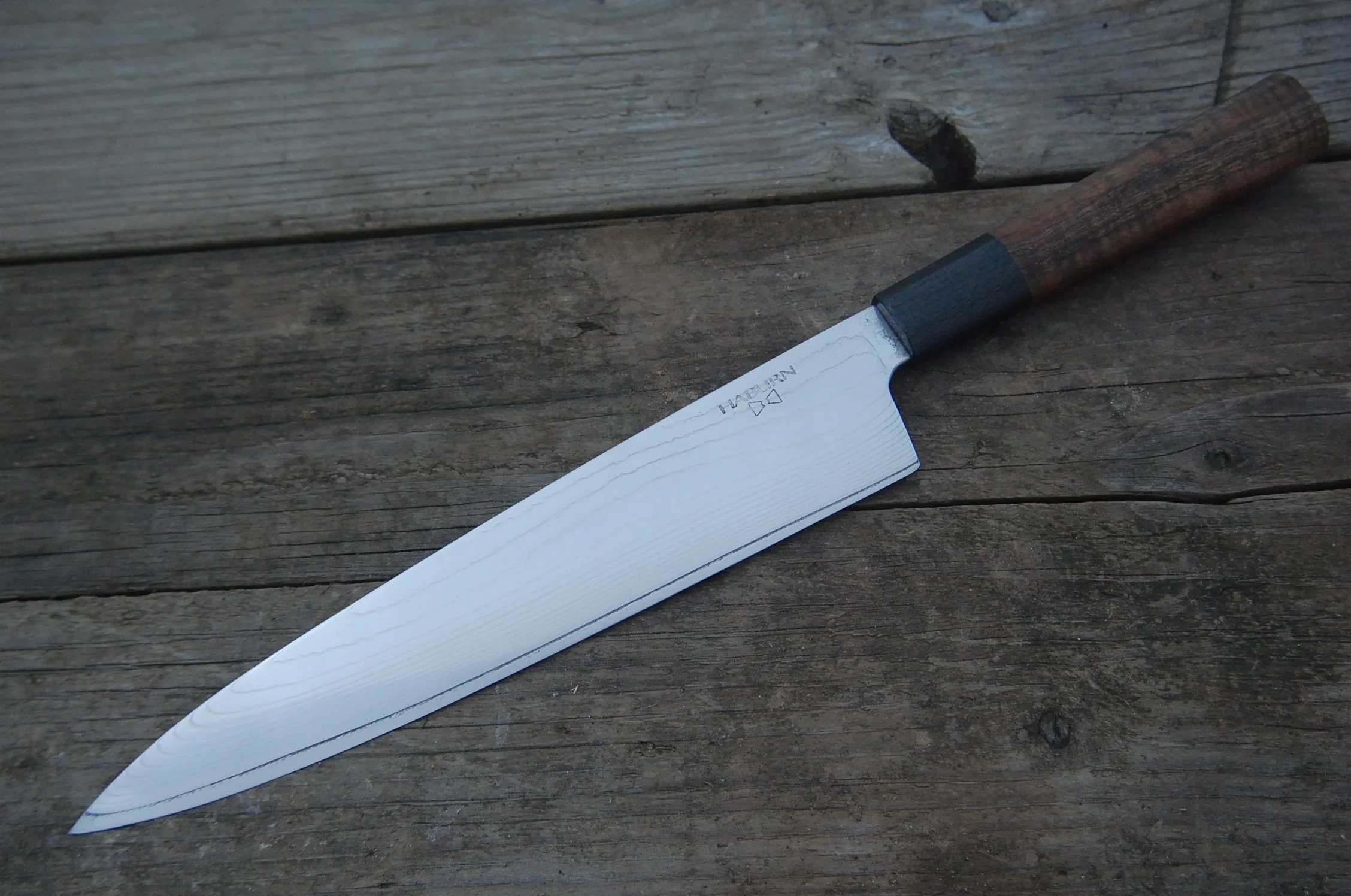 Gyuto in Super Gold 2 clad in stainless with carbon fiber and curly koa