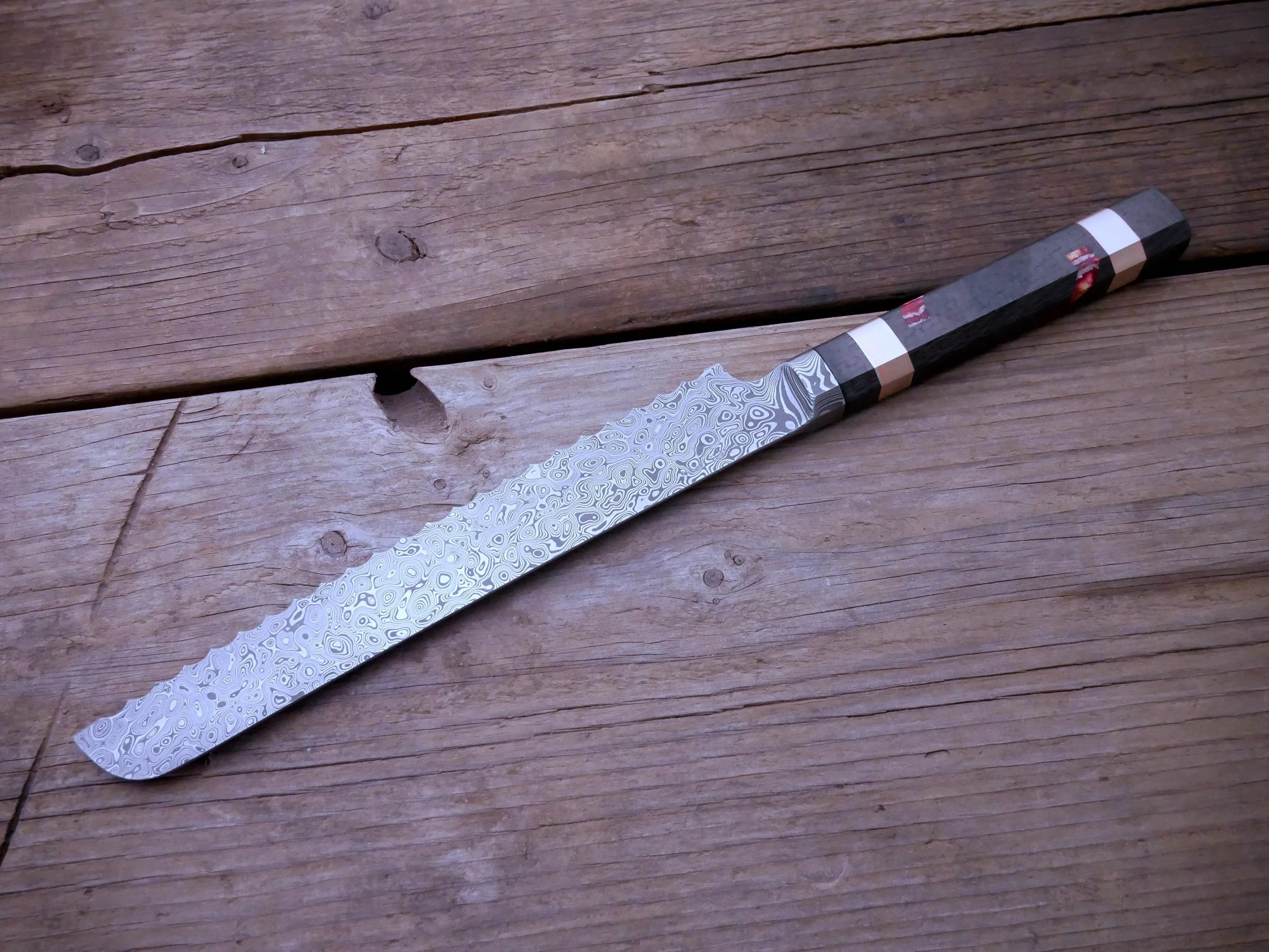 Custom Damascus Integral Bread Knife in Carbon Fiber, Mokume, and Mammoth Tooth