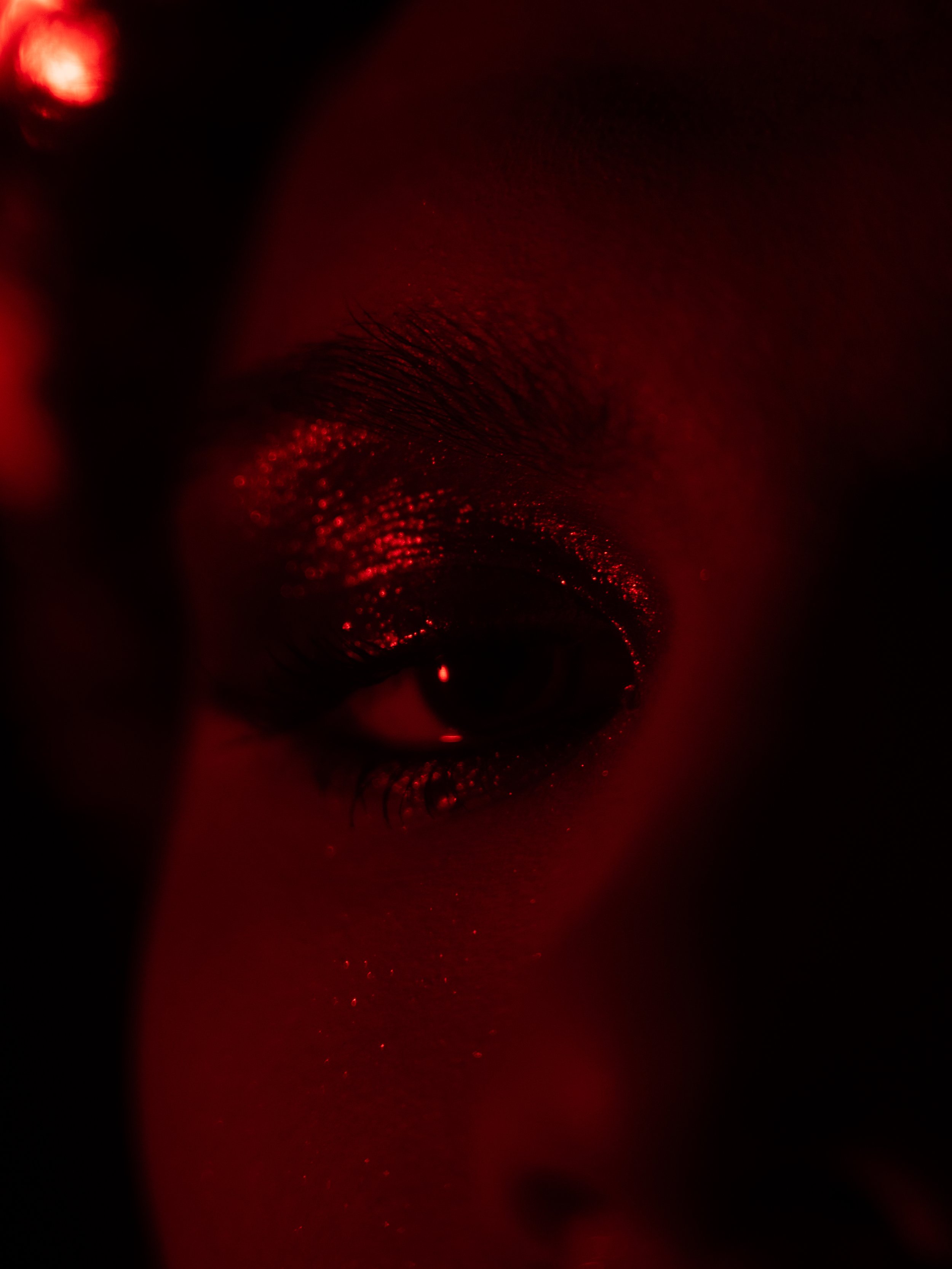 Cherry (Hare Hemopo) in a red makeup look created and photographed by Kylee De Thier