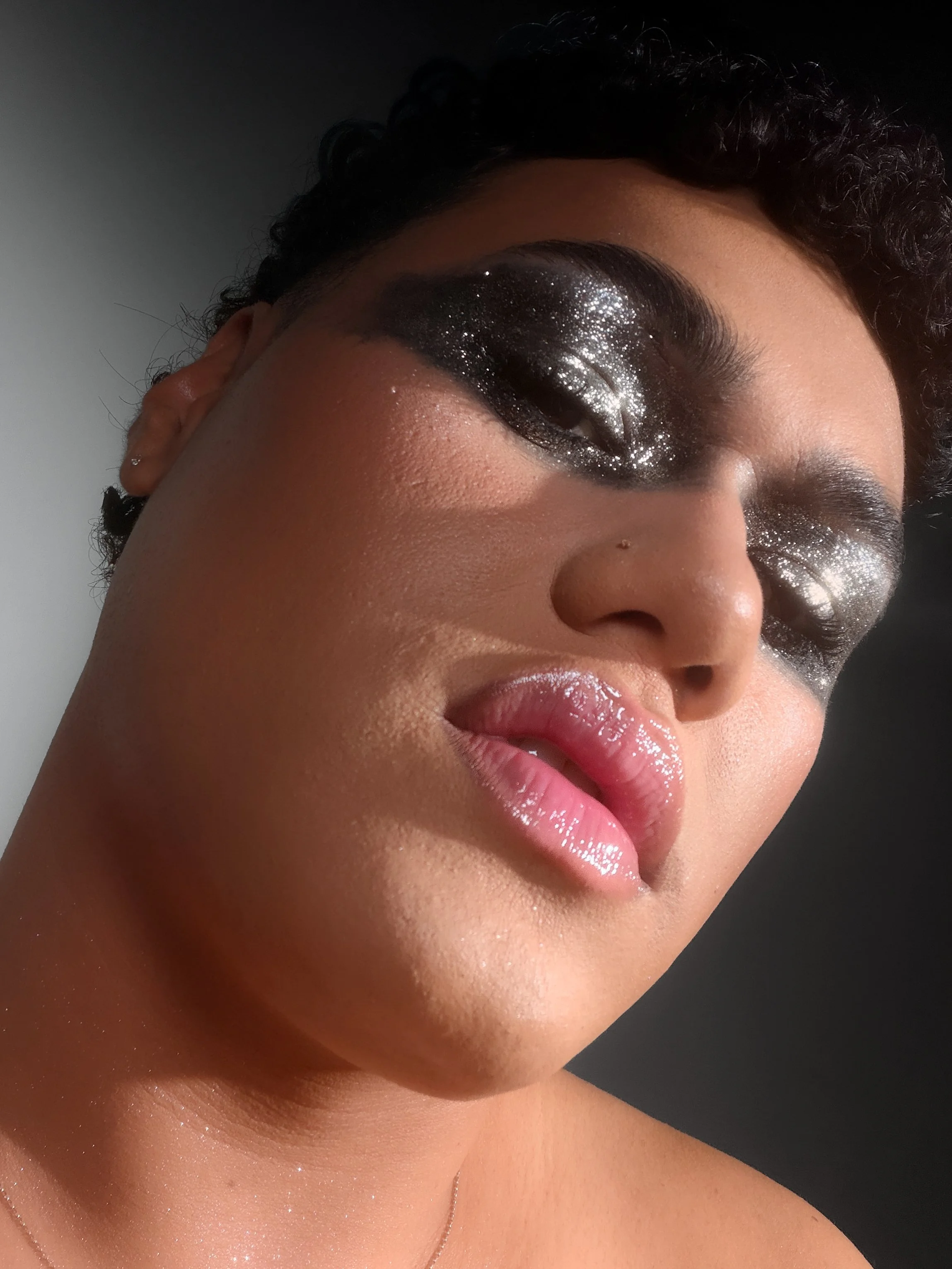Kylee De Thier in a sparkly silver editorial smokey eye makeup look inspired by Charli XCX Rock Music, iPhone selfie