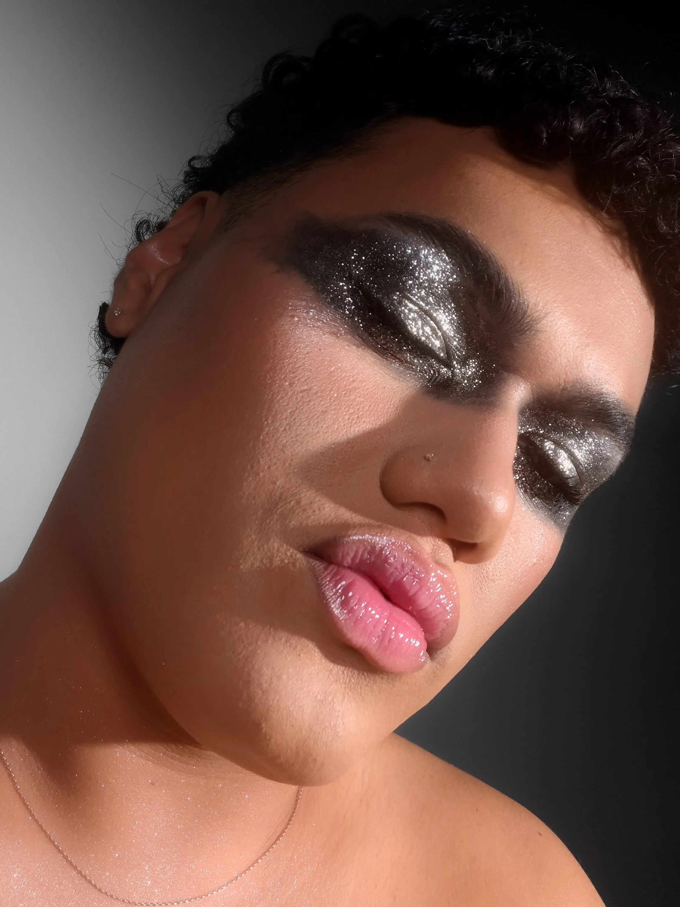 Kylee De Thier in a sparkly silver editorial smokey eye makeup look inspired by Charli XCX Rock Music, iPhone selfie