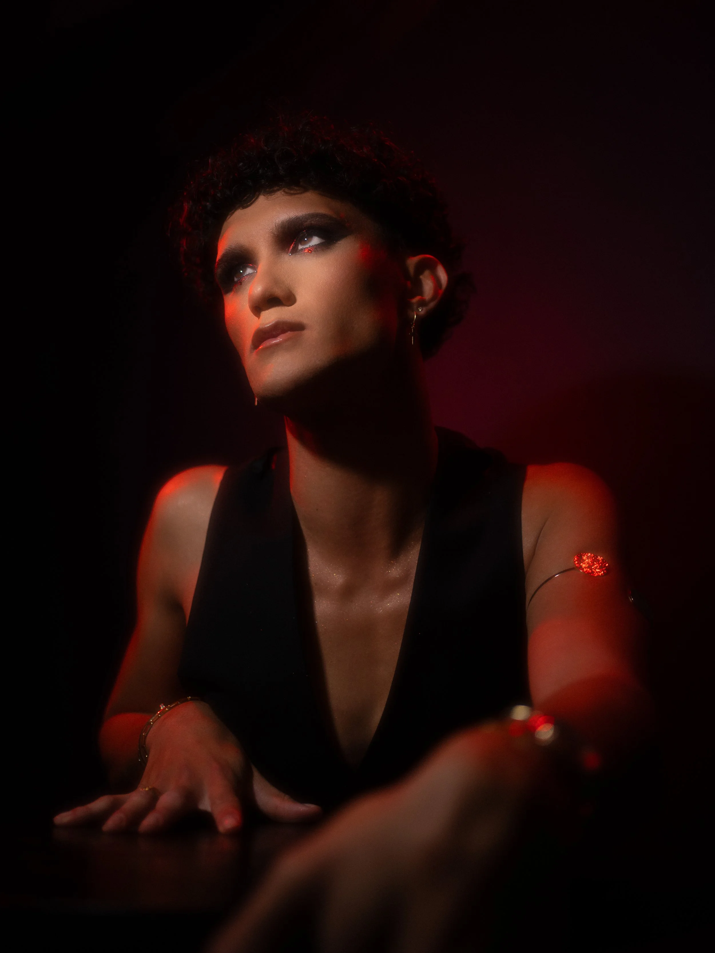 Cherry (Hare Hemopo) in a red makeup look created and photographed by Kylee De Thier