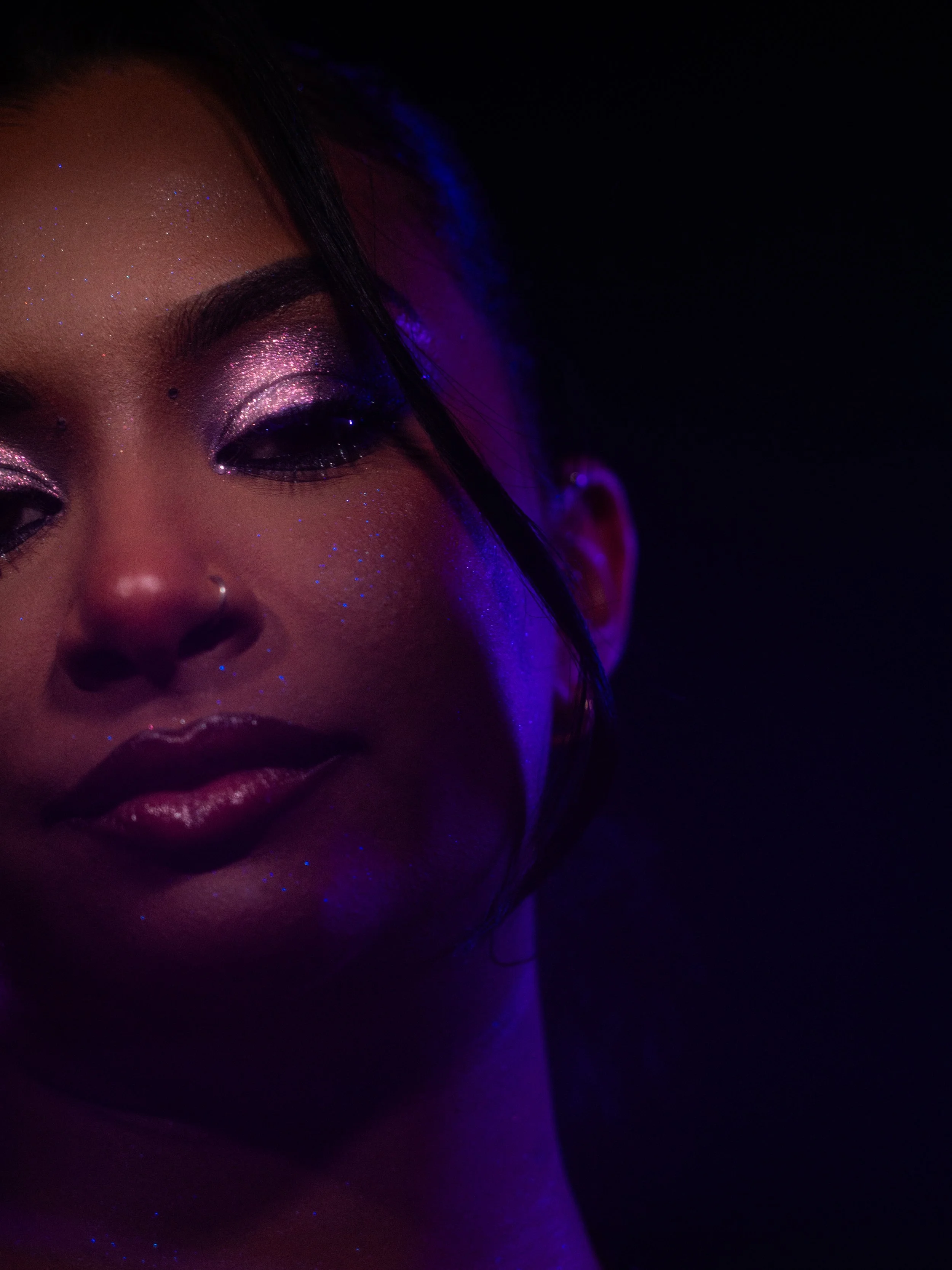 Nikita Chaithoo in a purple glitter makeup look created by makeup artist Kylee De Thier, photography and cinematography by Kylee De Thier