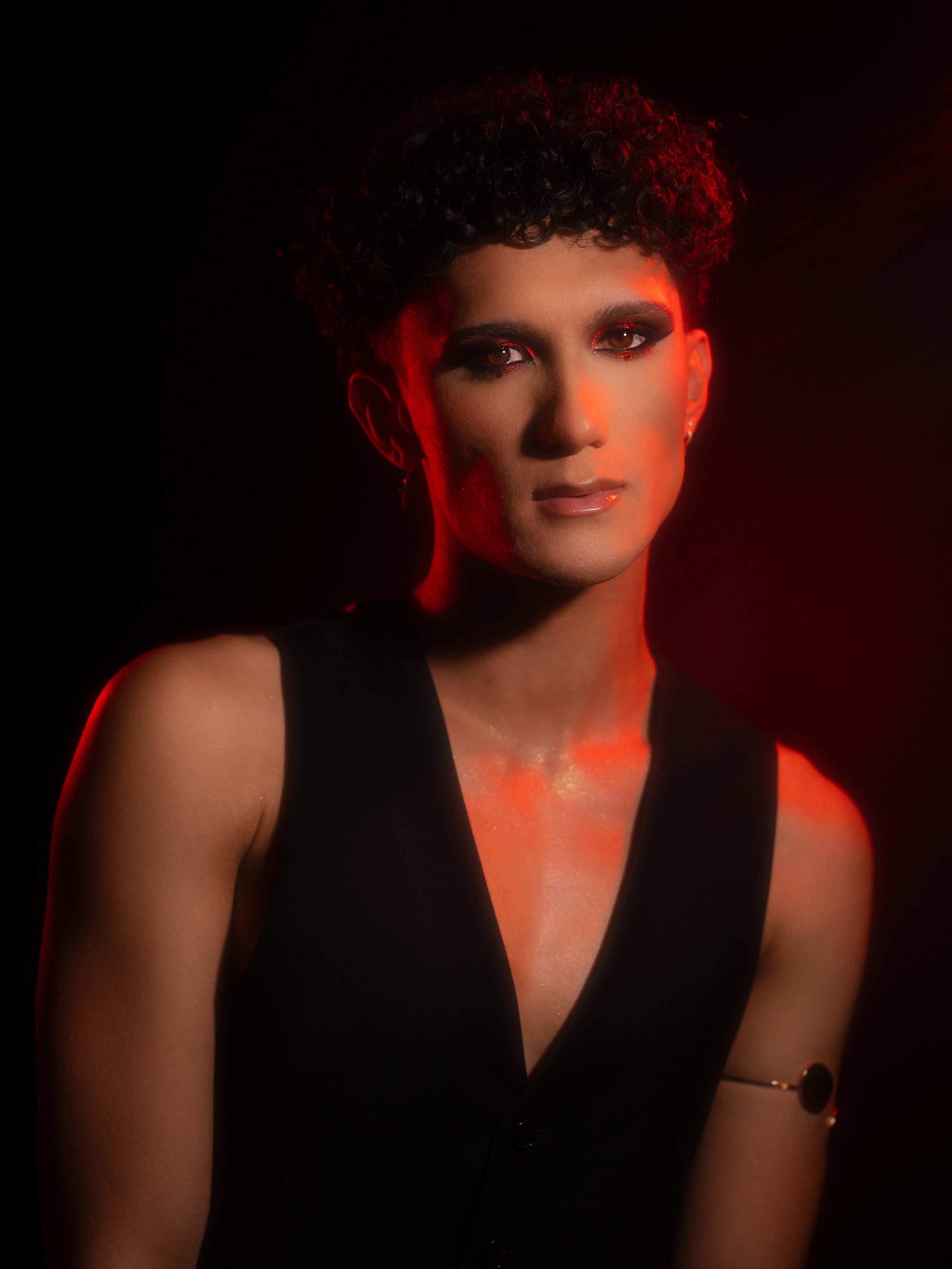 Cherry (Hare Hemopo) in a red makeup look created and photographed by Kylee De Thier