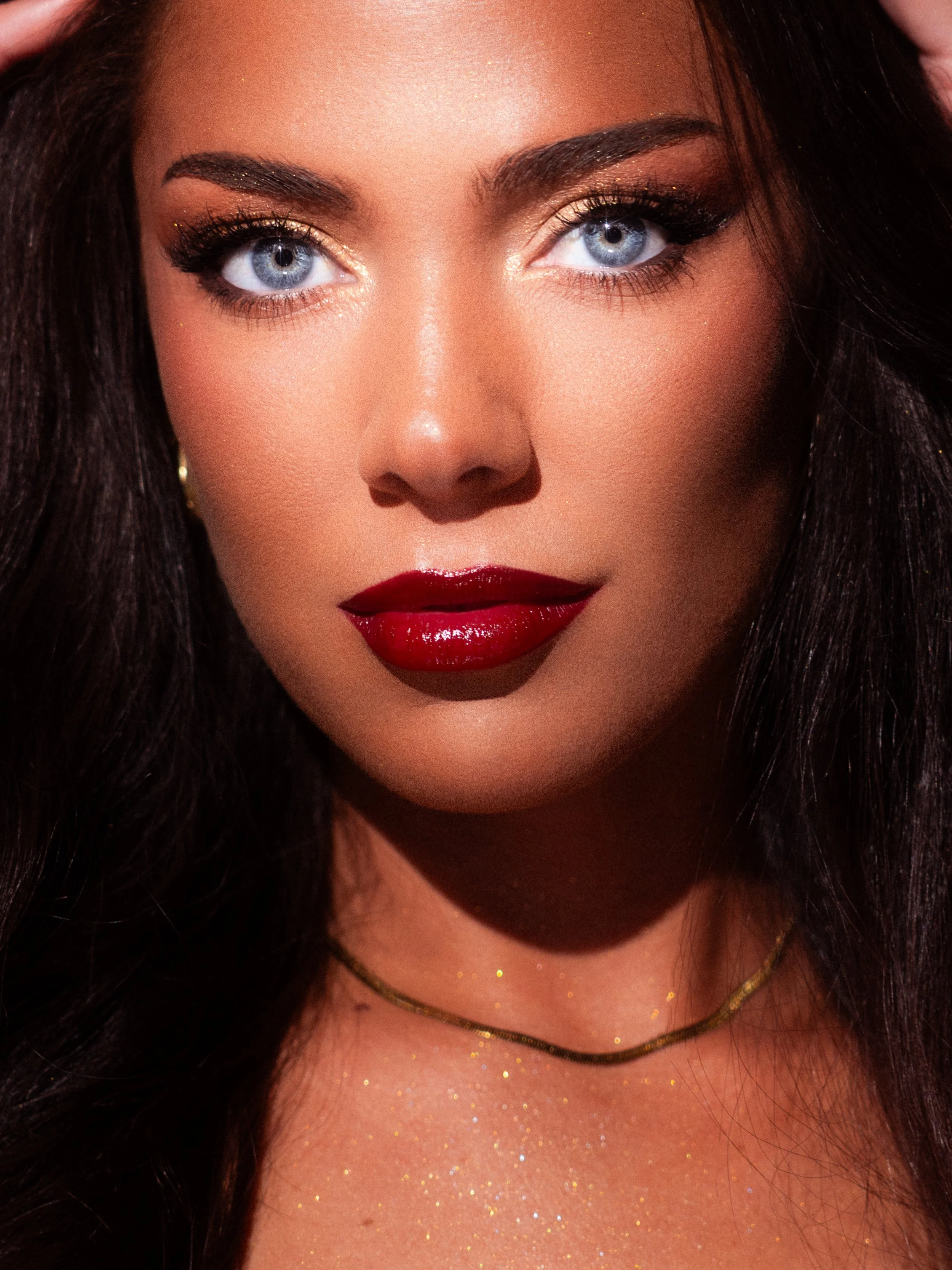 Kate Manihera stars in a golden, red carpet glam editorial makeup shoot with a bold red lip, inspired by Piece of Me by Britney Spears. Makeup artistry, photography, cinematography, post-production and creative direction by Māori New Zealand (Aotearo