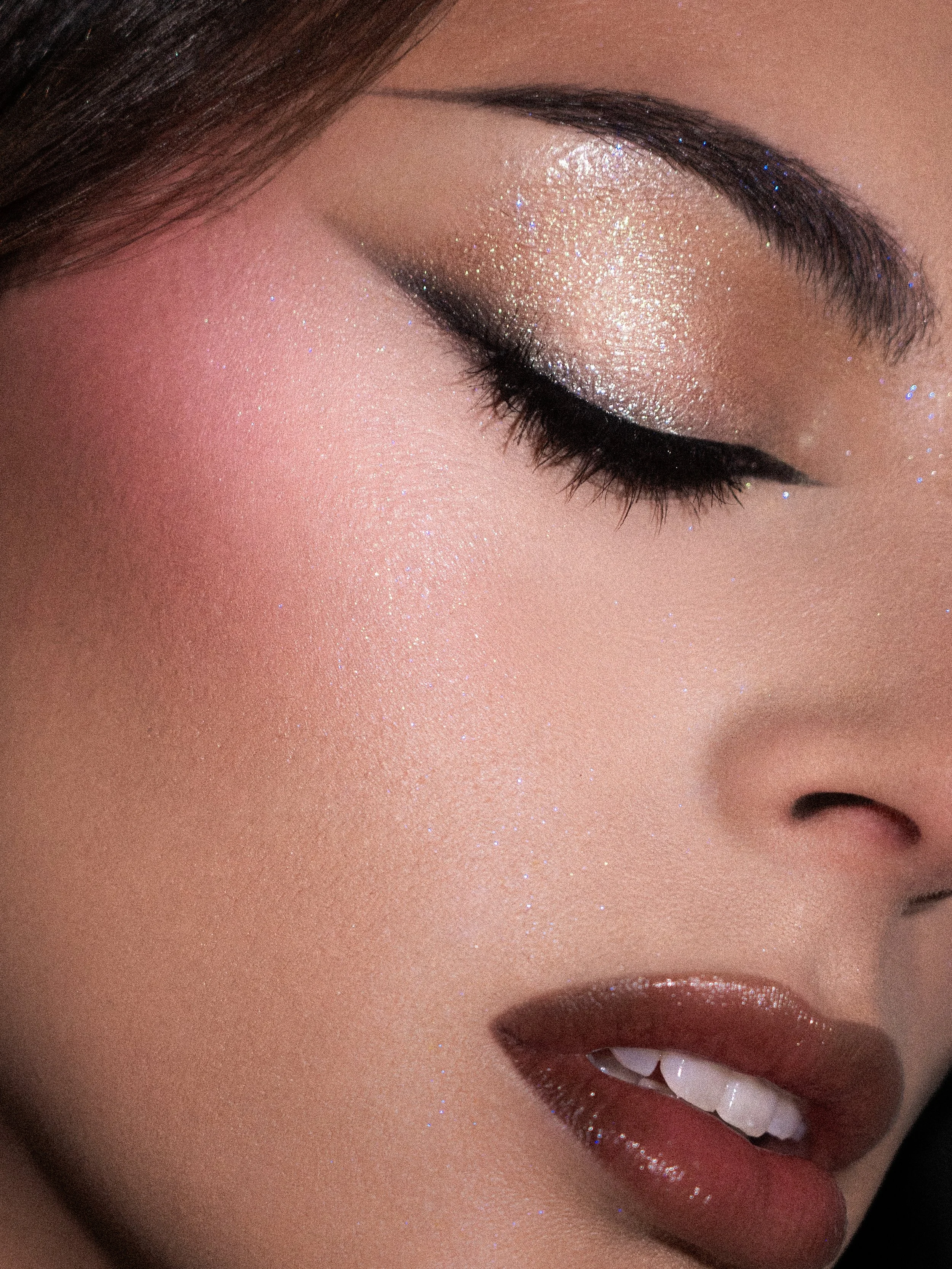 Sharp graphic liner editorial makeup on Tia Harris, inspired by THIQUE by Beyoncé for 4 years of RENAISSANCE, featuring Stolen Girlfriends Club's "The Defiant Ones" jewellery. Makeup, photography, cinematography, post-production and creative directio