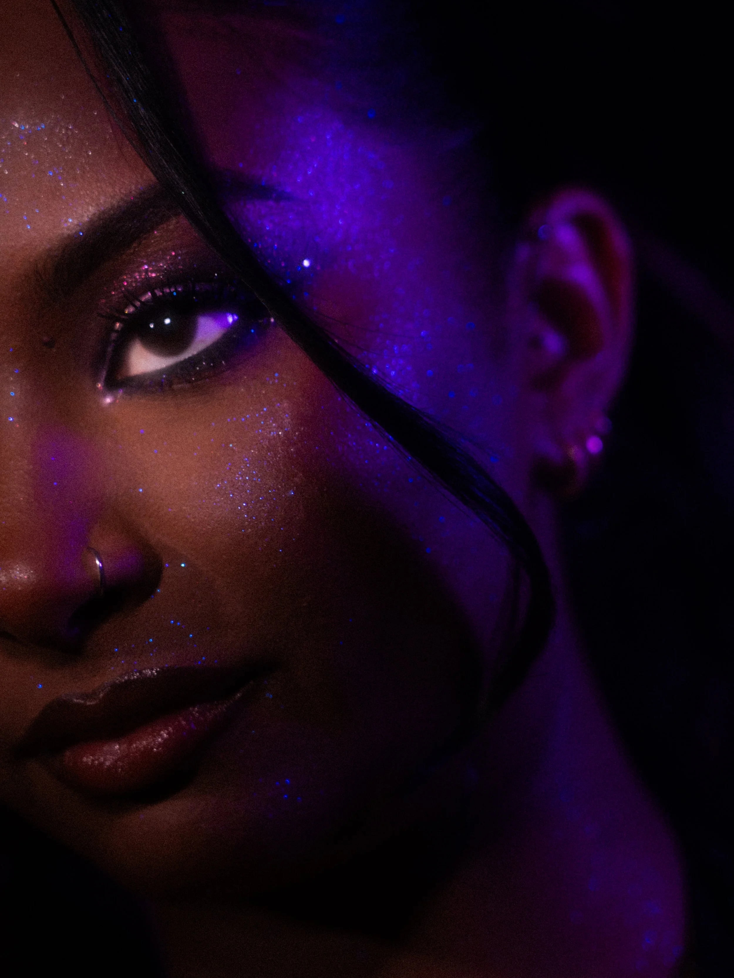Nikita Chaithoo in a purple glitter makeup look created by makeup artist Kylee De Thier, photography and cinematography by Kylee De Thier