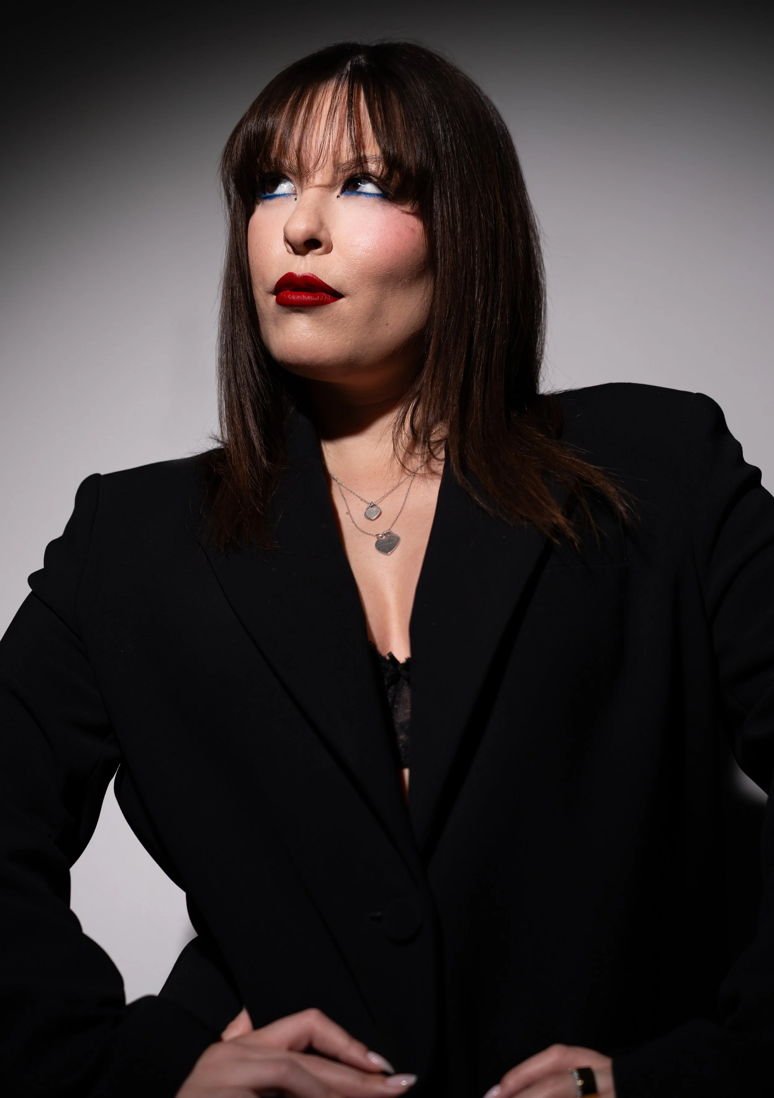 Bold blue liner and deep red lip editorial makeup shoot on Alluka Sakura inspired by 'IT Girl' by JADE. Makeup artistry, photography, cinematography, post-production and creative direction by Māori New Zealand (Aotearoa) content creator and influence