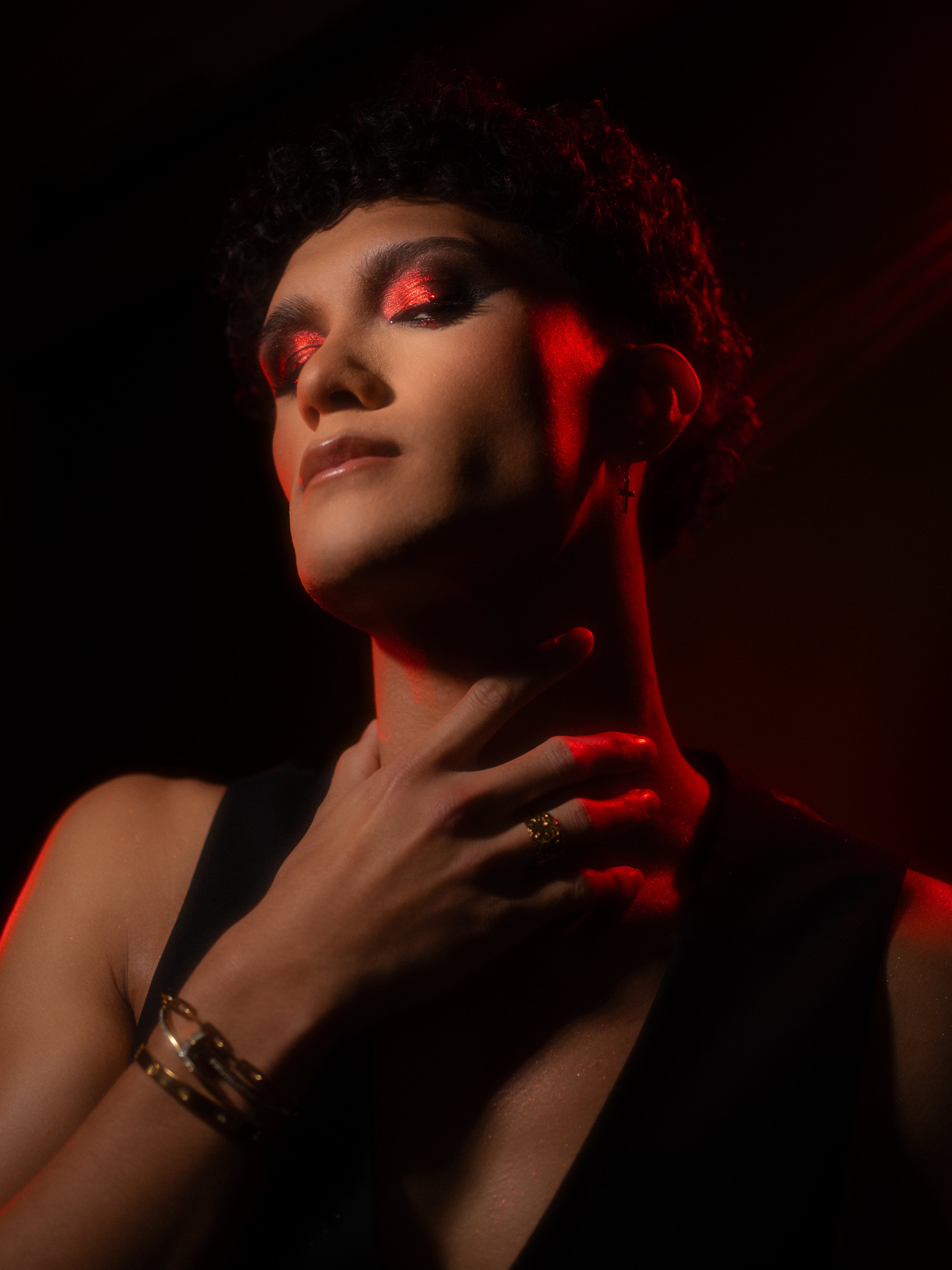 Cherry (Hare Hemopo) in a red makeup look created and photographed by Kylee De Thier